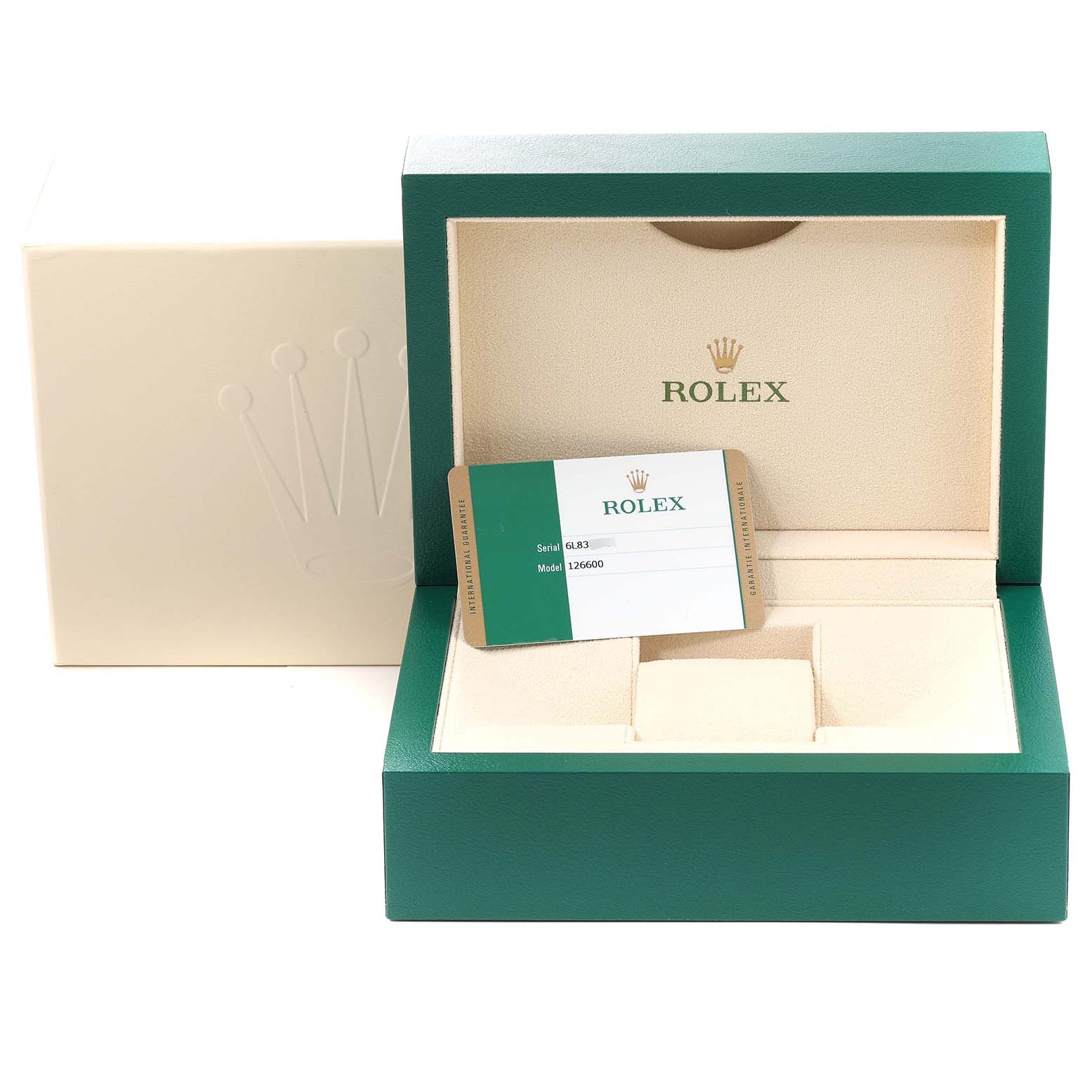 This image shows the open green and beige box of a Rolex Sea-Dweller 126600 Men
s Stainless Steel Black Dial 126600 Men
s Stainless Steel Black Dial watch, including the warranty card inside.