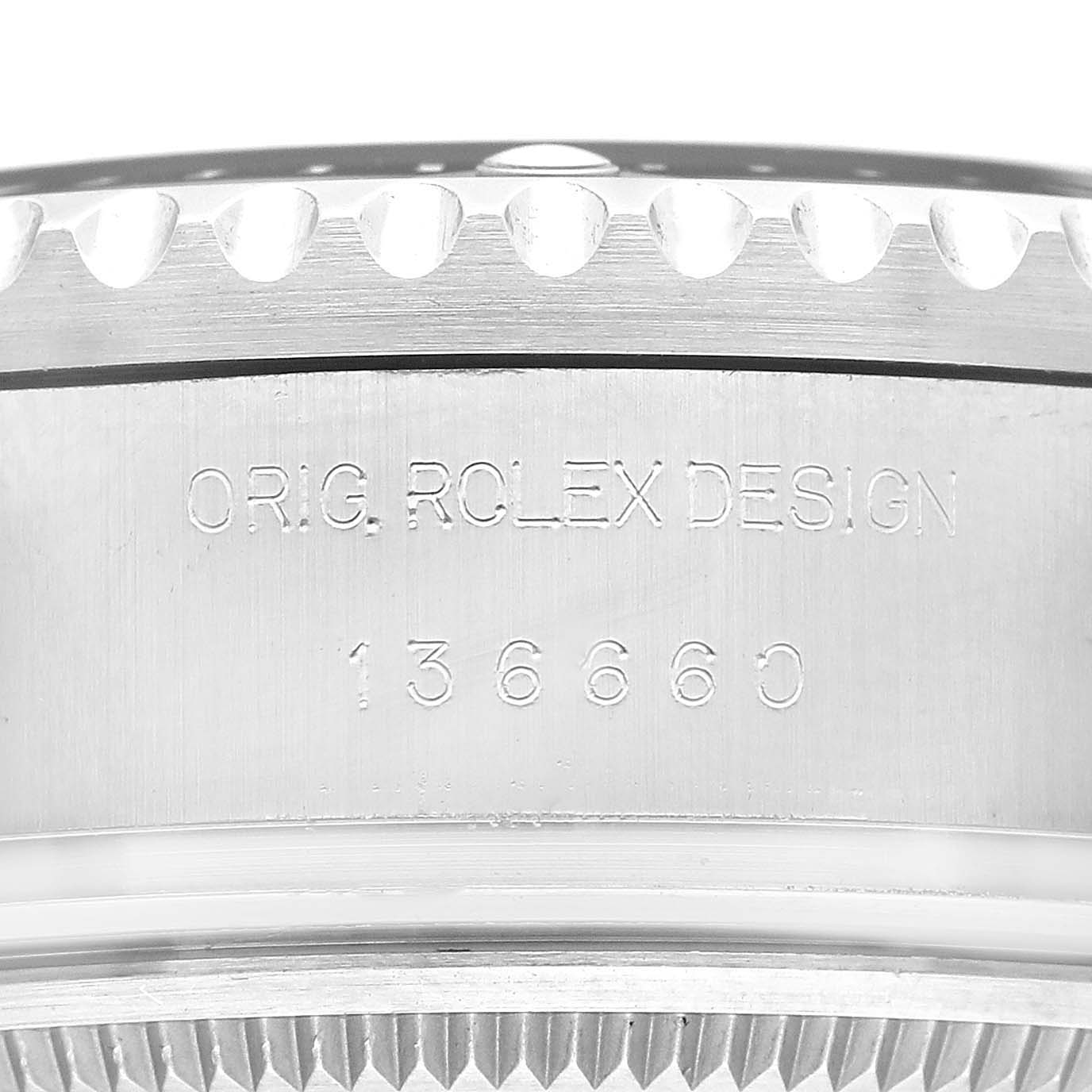 The image shows the side of the case of a Rolex Sea-Dweller 136660 Men's Stainless Steel Blue Dial 136660 Men's Stainless Steel Blue Dial watch with engravings of "ORIG. ROLEX DESIGN" and the model number "136660".