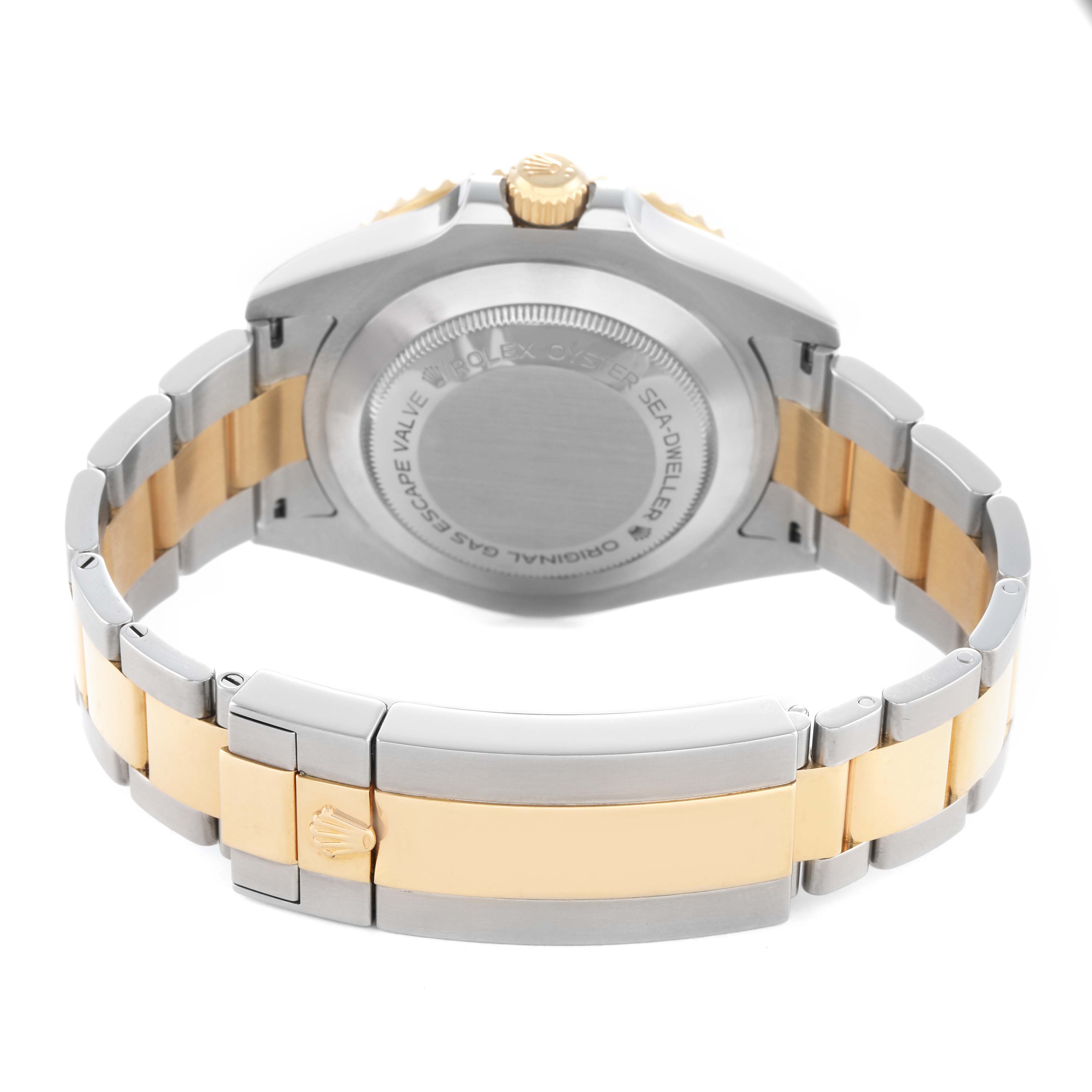 The Rolex Sea-Dweller 126603 Men's Steel and Gold (two tone) Black Dial watch is shown from the rear, highlighting the case back, crown, and two-tone bracelet.