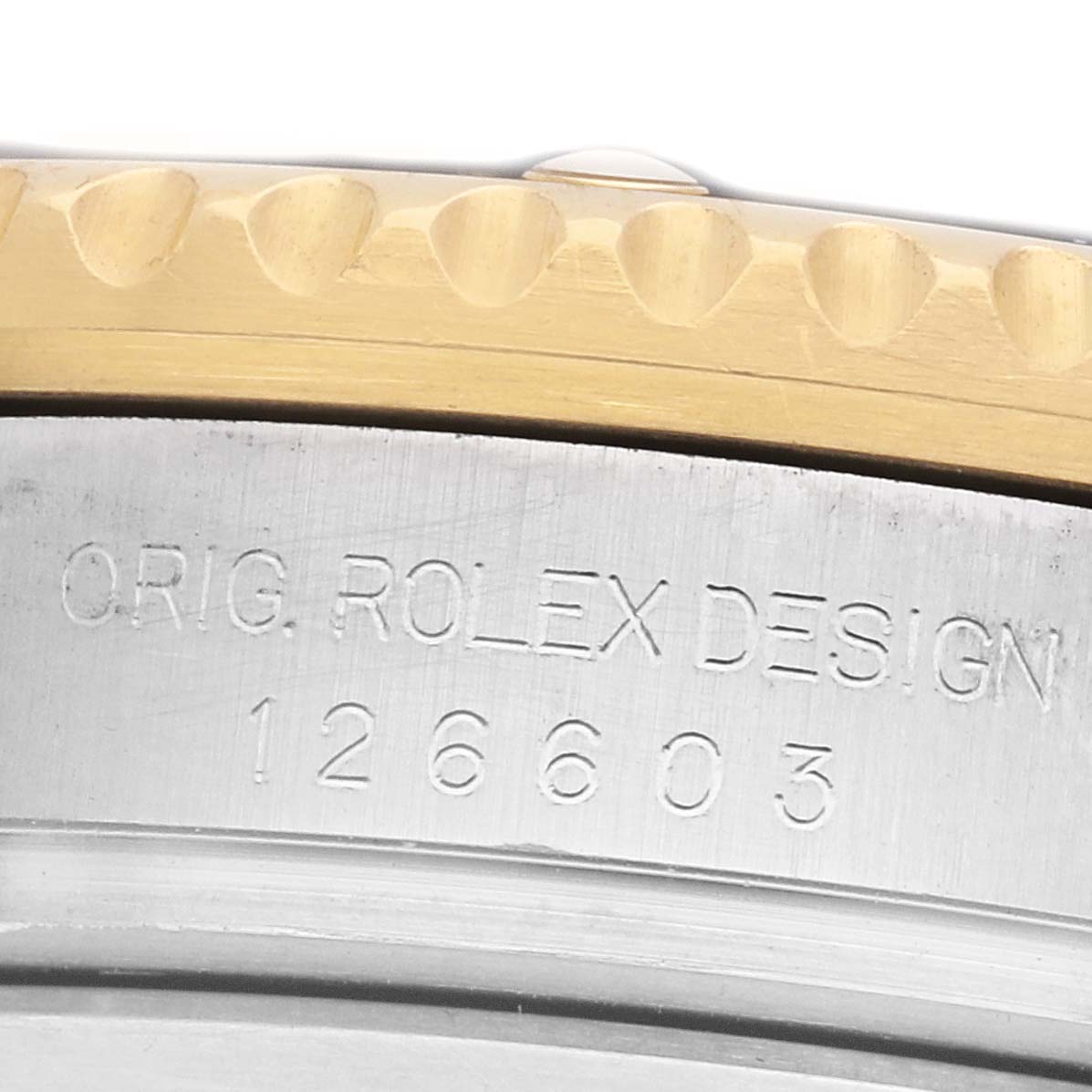 The image shows the side of a Rolex Sea-Dweller 126603 Men's Steel and Gold (two tone) Black Dial, focusing on the engraved model number and part of the bezel.