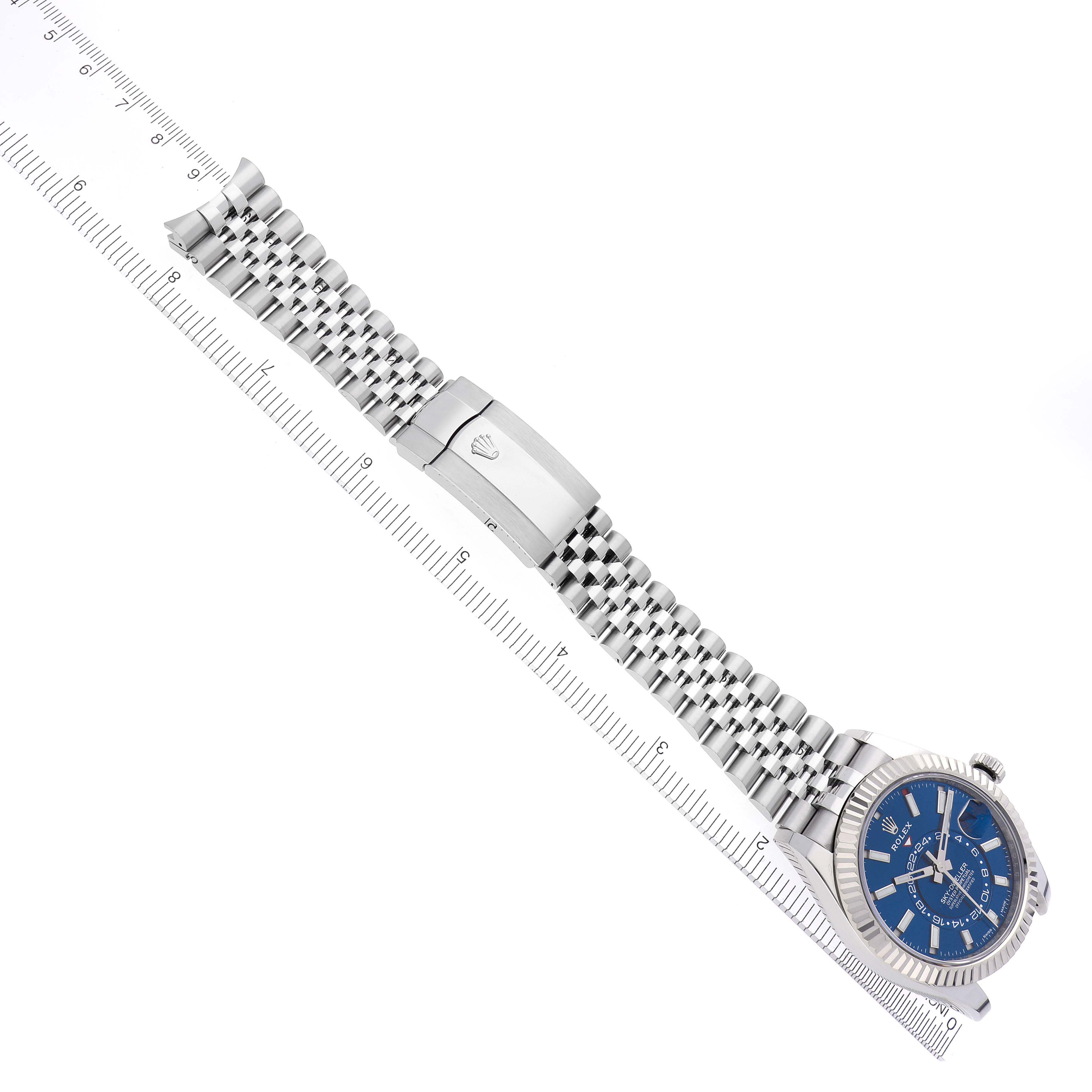 The Rolex Sky-Dweller 326934 Men
s Stainless Steel Blue Dial 326934 Men
s Stainless Steel Blue Dial watch is shown from above, displaying the bracelet, clasp, and blue dial.