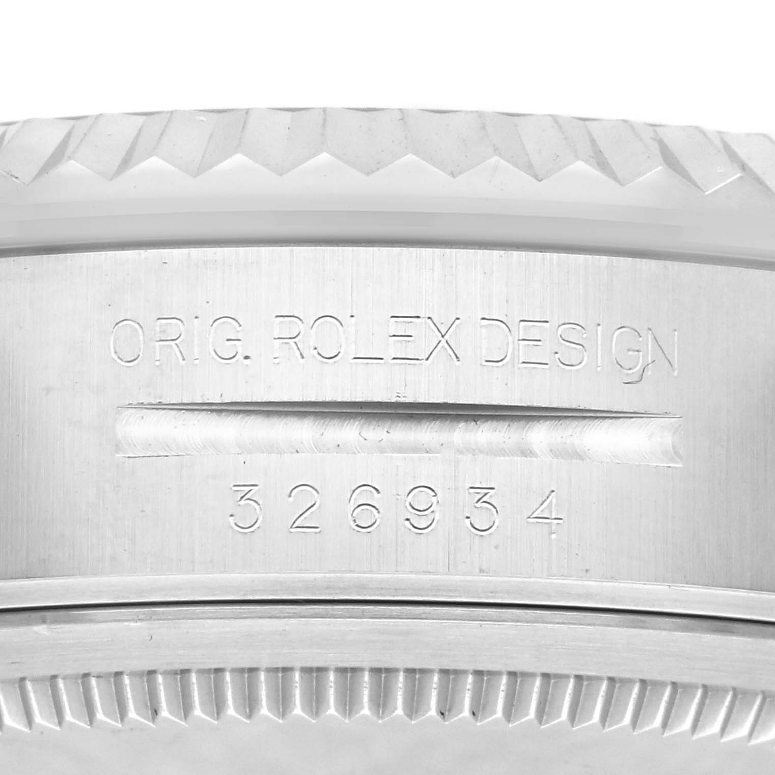 The image shows the side of a Rolex Sky-Dweller 326934 Men's Stainless Steel Blue Dial 326934 Men's Stainless Steel Blue Dial's case, highlighting the engraved model number and design details.