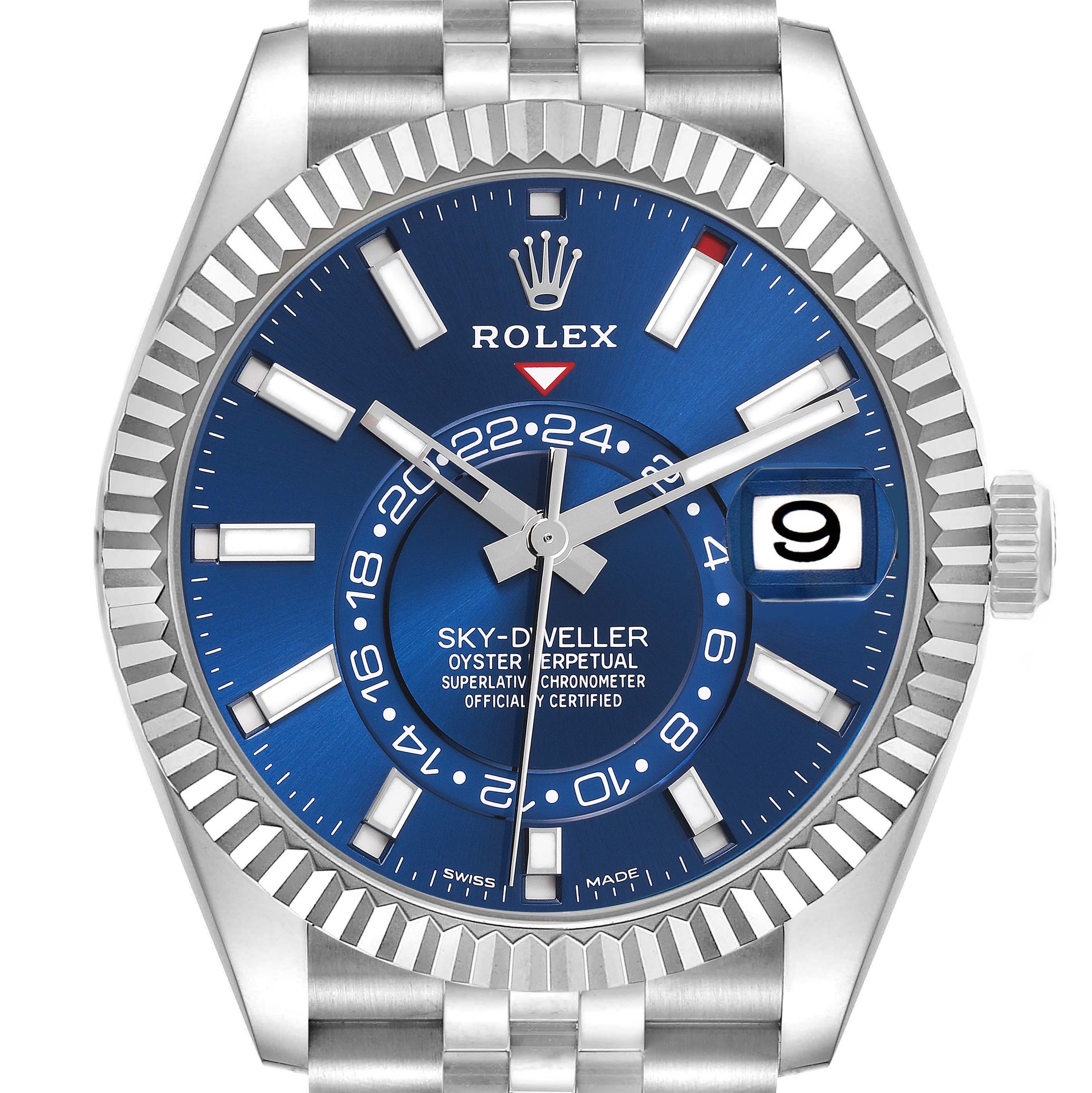The Rolex Sky-Dweller 326934 Men's Stainless Steel Blue Dial 326934 Men's Stainless Steel Blue Dial watch is shown from the front, highlighting the blue dial, fluted bezel, and date window.