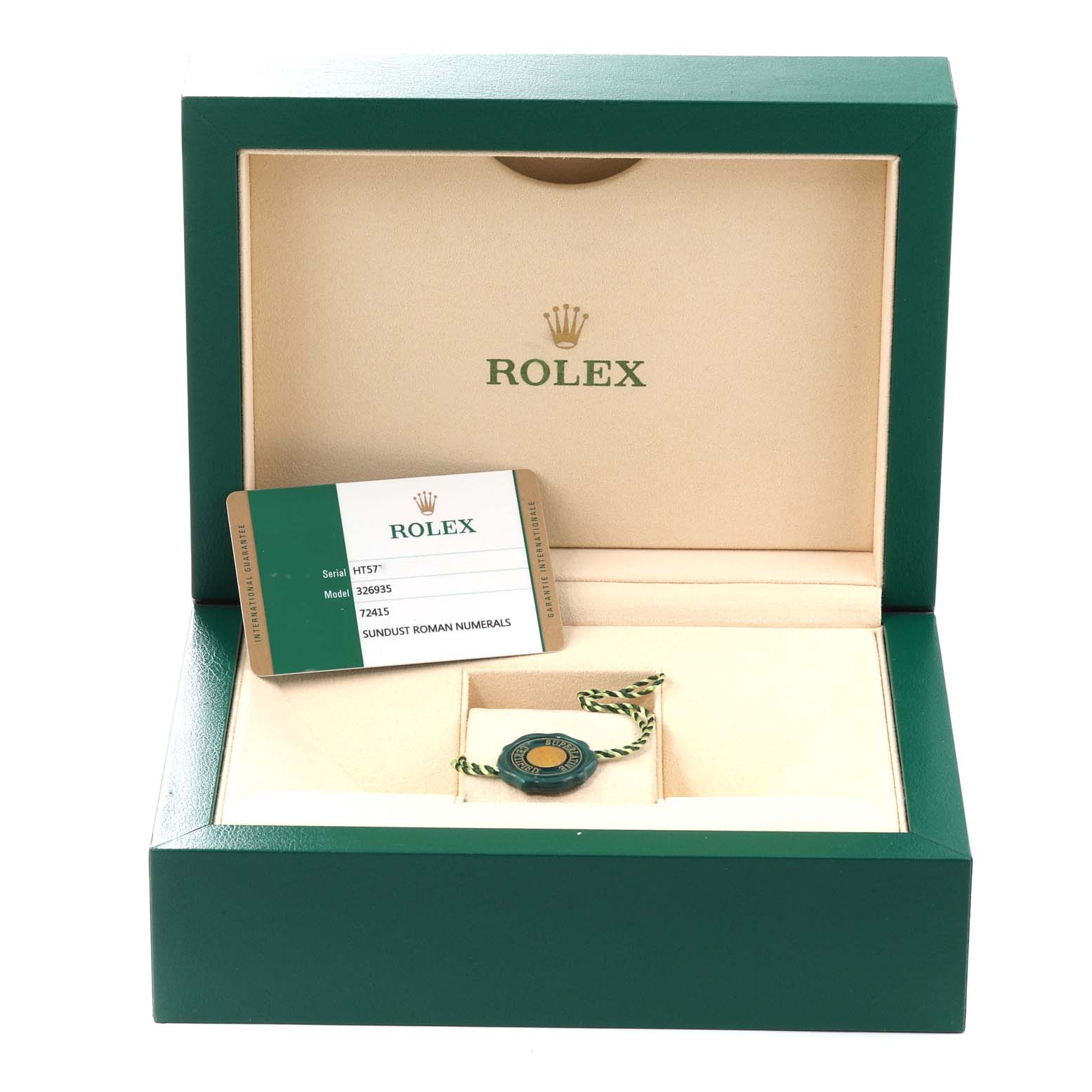 The image shows an open Rolex Sky-Dweller 326935 Men's Rose Gold Pink Dial 326935 Men's Rose Gold Pink Dial watch box containing a serial card and a green and gold tag.