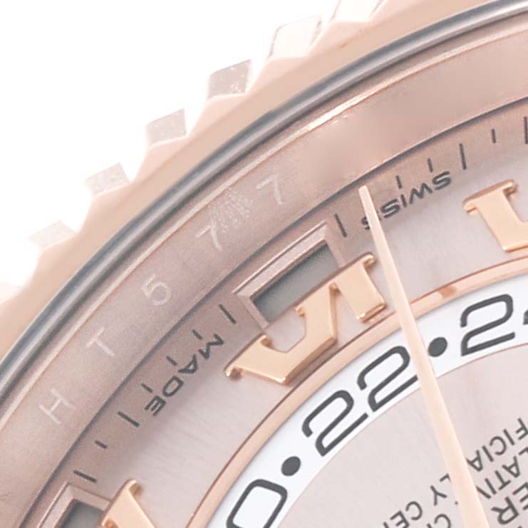 The image shows a close-up of the dial and bezel of a Rolex Sky-Dweller 326935 Men's Rose Gold Pink Dial 326935 Men's Rose Gold Pink Dial watch, highlighting the hour markers and part of the date display.