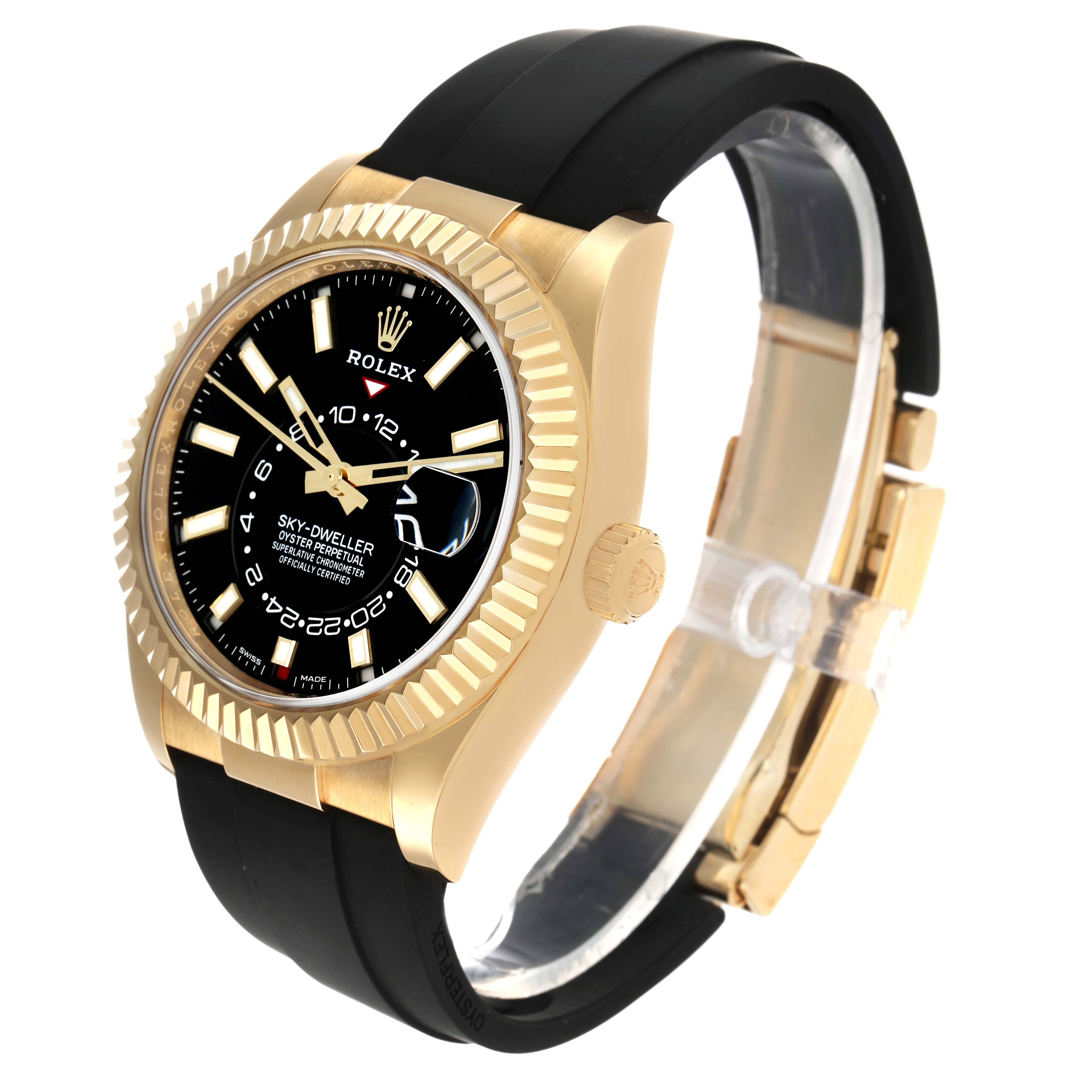 The Rolex Sky-Dweller 326238 Men's Yellow Gold Black Dial watch is shown at an angled side view, displaying the bezel, dial, crown, and rubber strap.
