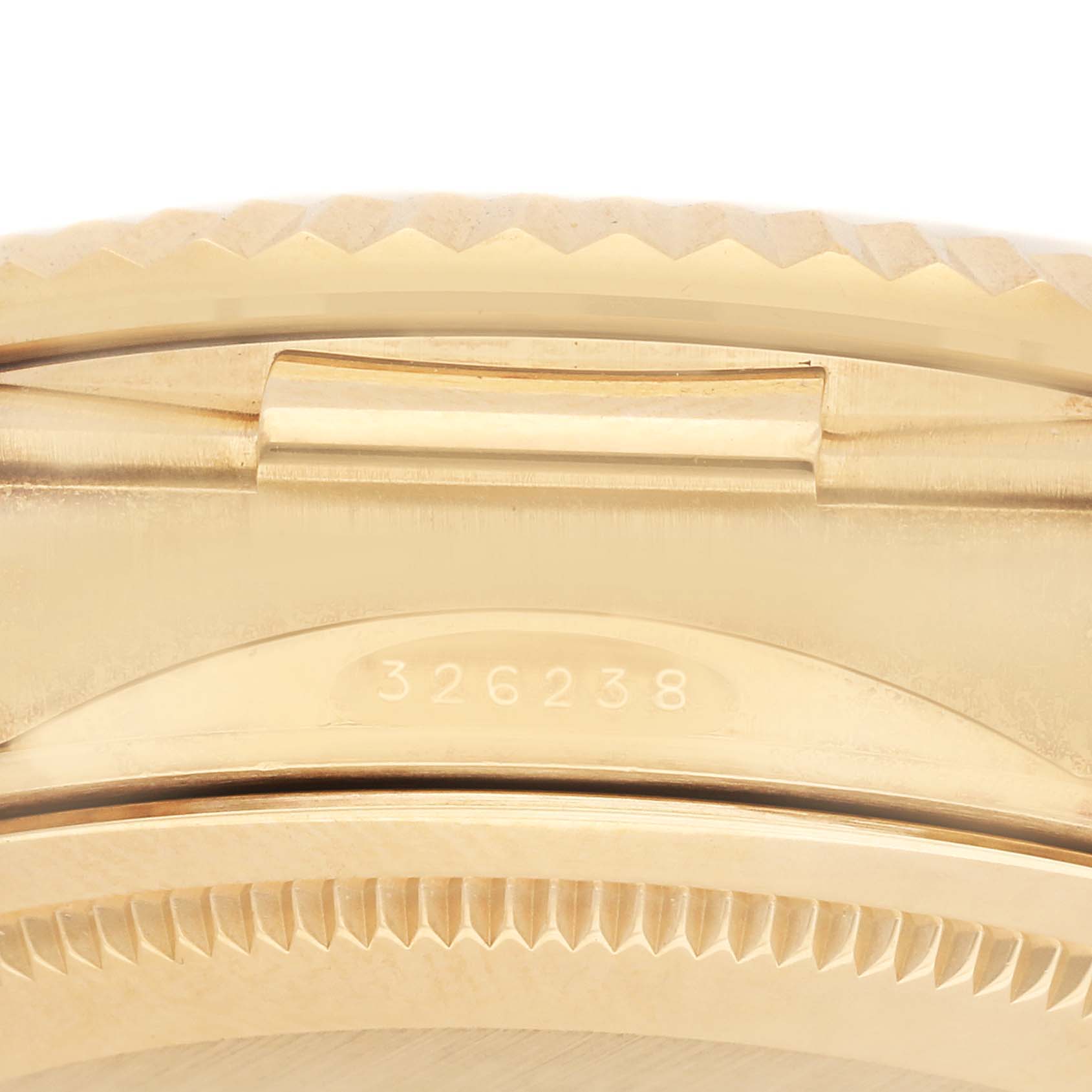 The image shows the side profile of a Rolex Sky-Dweller 326238 Men's Yellow Gold Black Dial watch, highlighting its bezel, edge, and case number.