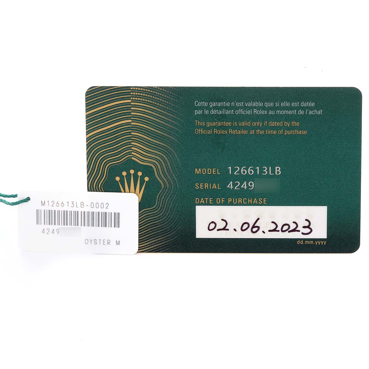 The image shows a warranty card and tag for the Rolex Submariner 126613LB Men's Steel and Gold (two tone) Blue Dial 126613LB Men's Steel and Gold (two tone) Blue Dial model 126613LB.