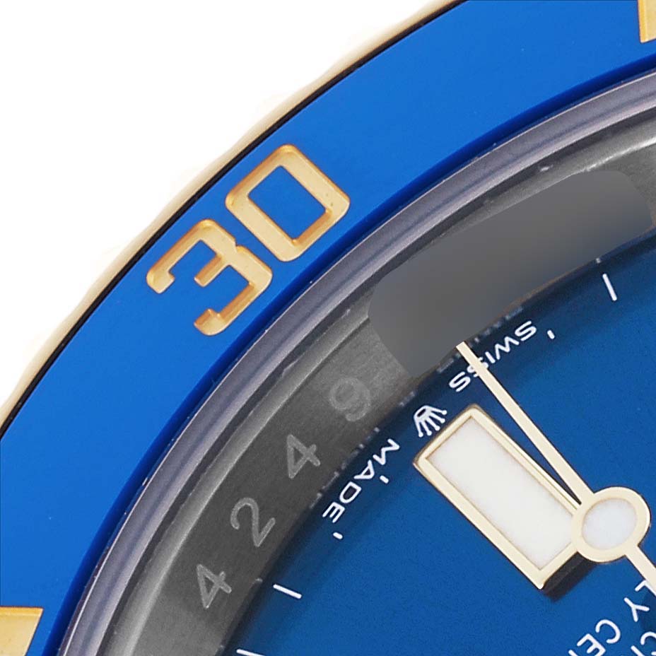 The image shows a close-up of the bezel and part of the dial of a Rolex Submariner 126613LB Men's Steel and Gold (two tone) Blue Dial 126613LB Men's Steel and Gold (two tone) Blue Dial watch, highlighting the "30" marker.