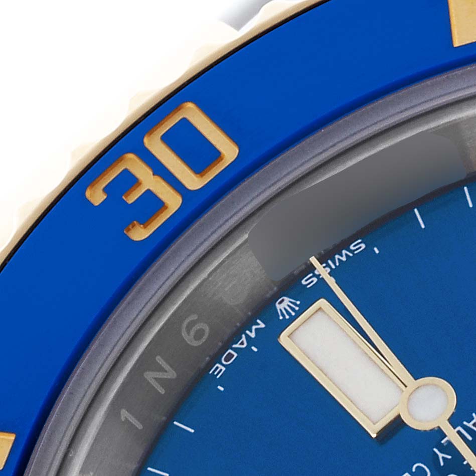 The image shows a close-up of the blue bezel and dial of a Rolex Submariner 126613LB Men's Steel and Gold (two tone) Blue Dial 126613LB Men's Steel and Gold (two tone) Blue Dial, highlighting the 30 marker and part of the watch face.