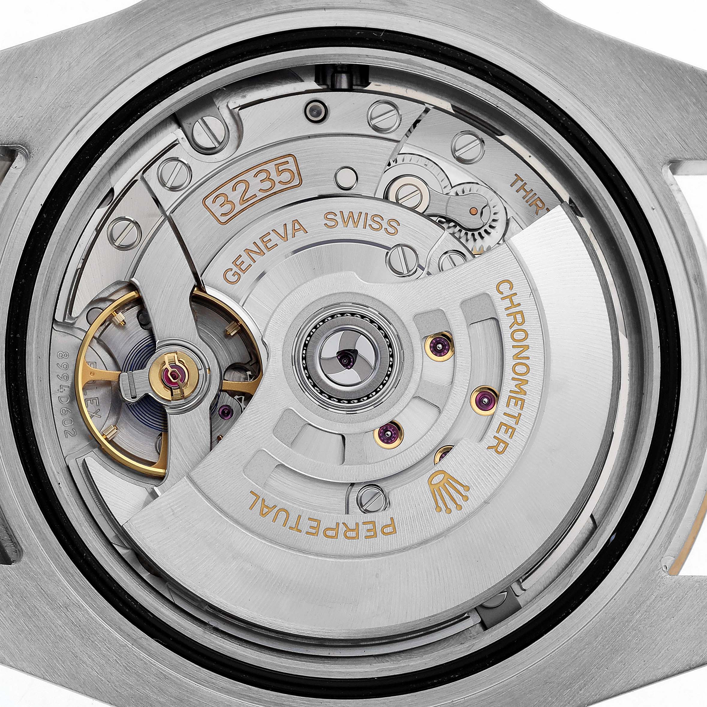 The image shows a close-up of the Rolex Submariner 126613LB Men's Steel and Gold (two tone) Blue Dial 126613LB Men's Steel and Gold (two tone) Blue Dial's movement, highlighting its intricate mechanical parts.