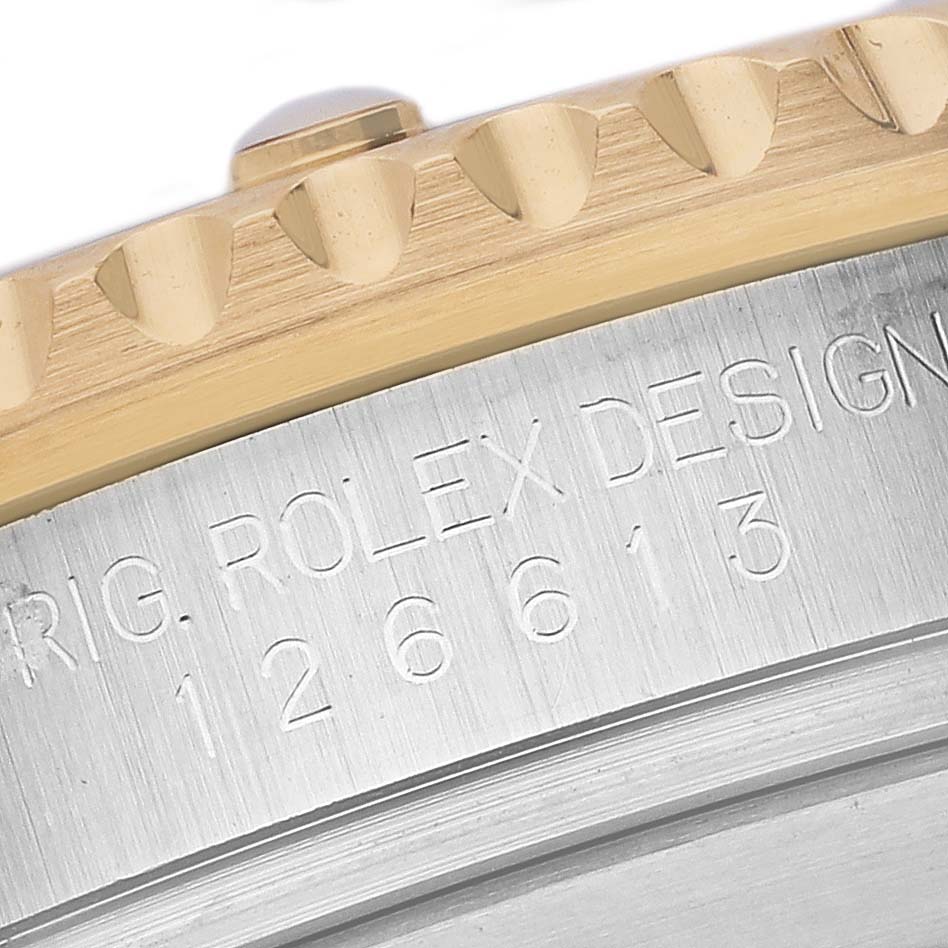 The image shows a close-up of the case side with etched model details of a Rolex Submariner 126613LB Men's Steel and Gold (two tone) Blue Dial 126613LB Men's Steel and Gold (two tone) Blue Dial.