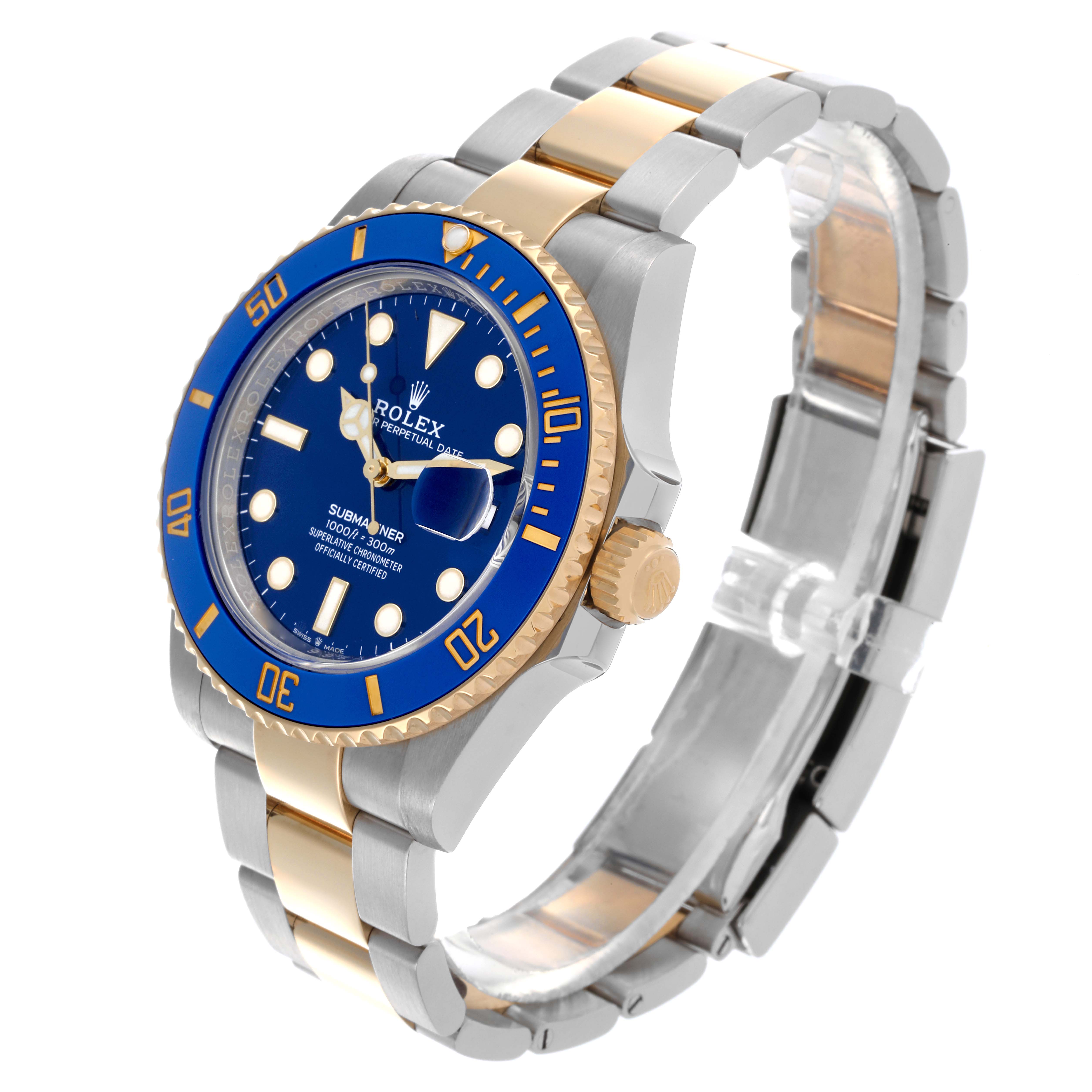 The Rolex Submariner 126613 Men's Steel and Gold (two tone) Blue Dial 126613 Men's Steel and Gold (two tone) Blue Dial is shown at a three-quarter angle, highlighting the blue dial, bezel, and two-tone bracelet.