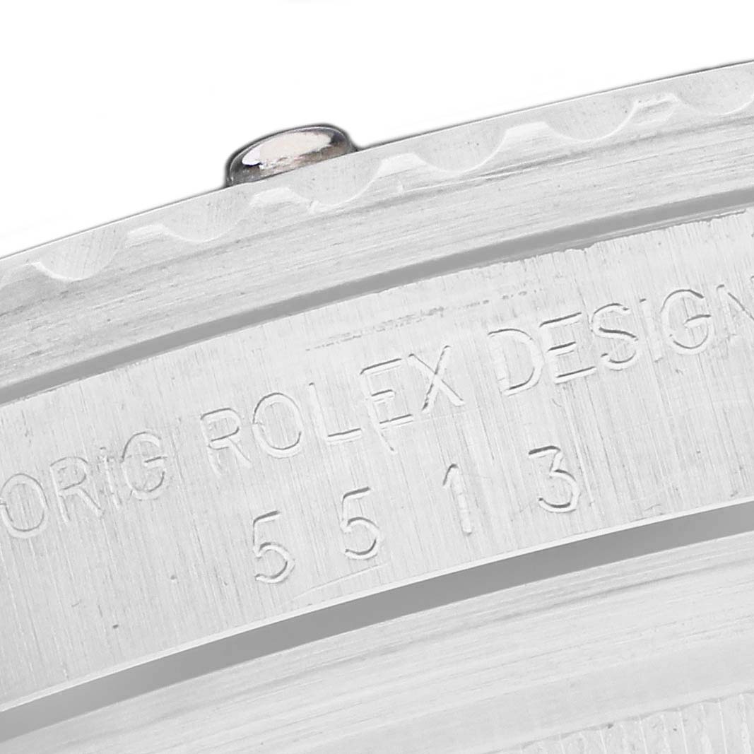 The image shows a close-up of the engraved side of a Rolex Submariner 5513 Men's Stainless Steel Black Dial watch case, highlighting model details.