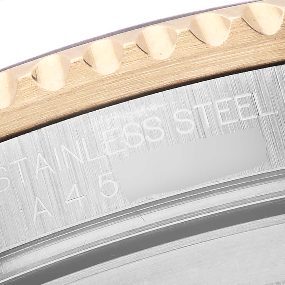 The image shows a close-up of the bezel and engraved case edge of a Rolex Submariner 16613 Men's Steel and Gold (two tone) Blue Dial 16613 Men's Steel and Gold (two tone) Blue Dial watch.