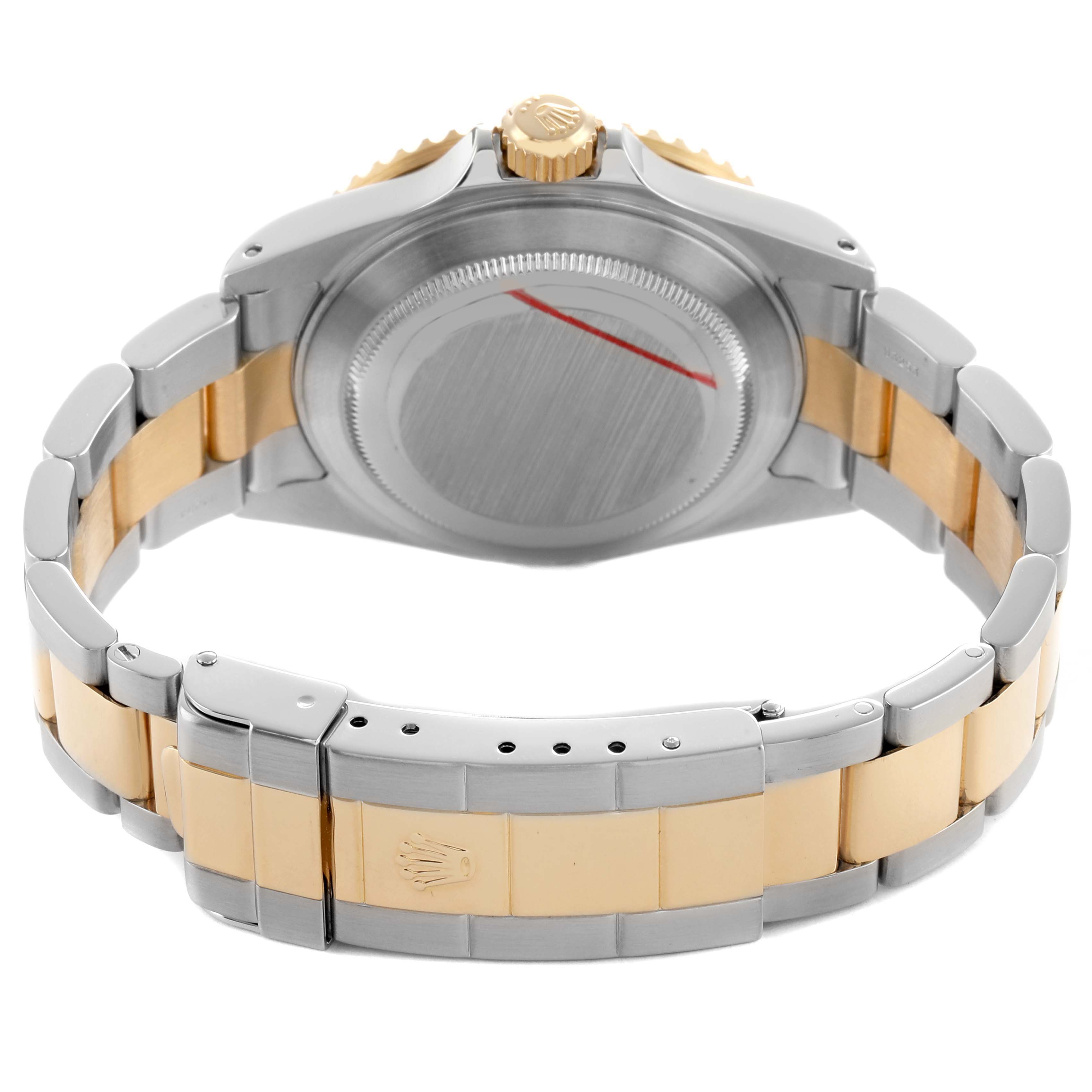 The image shows the back of a Rolex Submariner 16613 Men's Steel and Gold (two tone) Silver Dial, highlighting the case back, crown, and the two-tone metal bracelet with clasp.