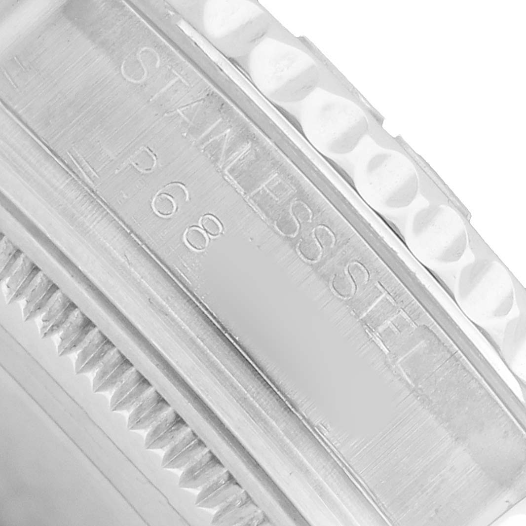 The image shows a close-up of the side of a Rolex Yacht-Master 168622 Men's Stainless Steel Silver Dial, highlighting the bezel and "Stainless Steel" engraving.