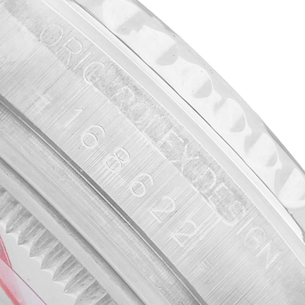 The image shows a close-up of the engraved inner bezel of a Rolex Yacht-Master 168622 Men's Stainless Steel Silver Dial watch.