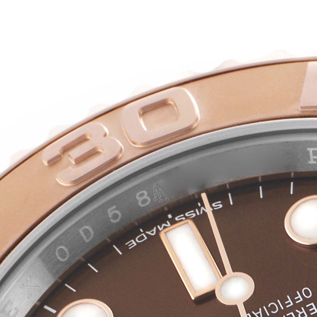 The image shows a close-up of the bezel and part of the dial of a Rolex Yacht-Master 116621 Men's Steel and Gold (two tone) Brown Dial watch, highlighting the "30" marker.