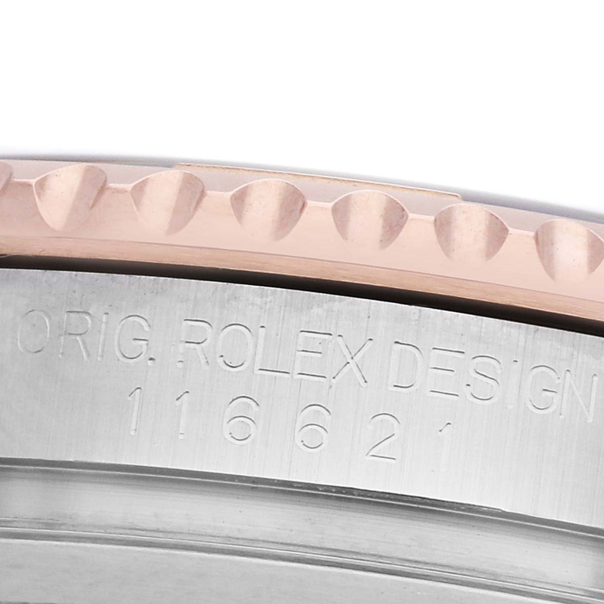 The image shows a close-up of the Rolex Yacht-Master 116621 Men's Steel and Gold (two tone) Brown Dial model's case edge and engraved bezel.