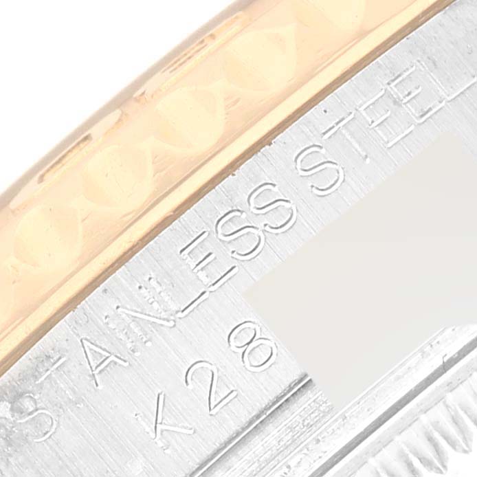 This is a close-up shot of the Yacht-Master Rolex watch showing parts of the bezel and case side.