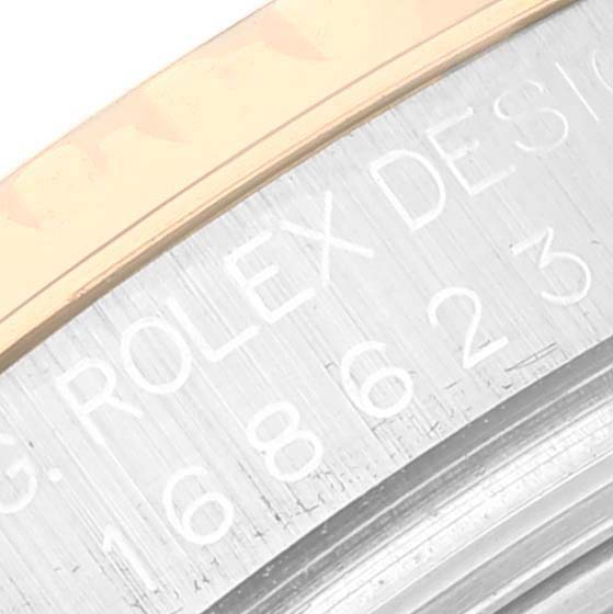 The image shows a close-up of the side engraving on a Rolex Yacht-Master 168623 Men
s Steel and Gold (two tone) White Dial 168623 Men
s Steel and Gold (two tone) White Dial watch case.