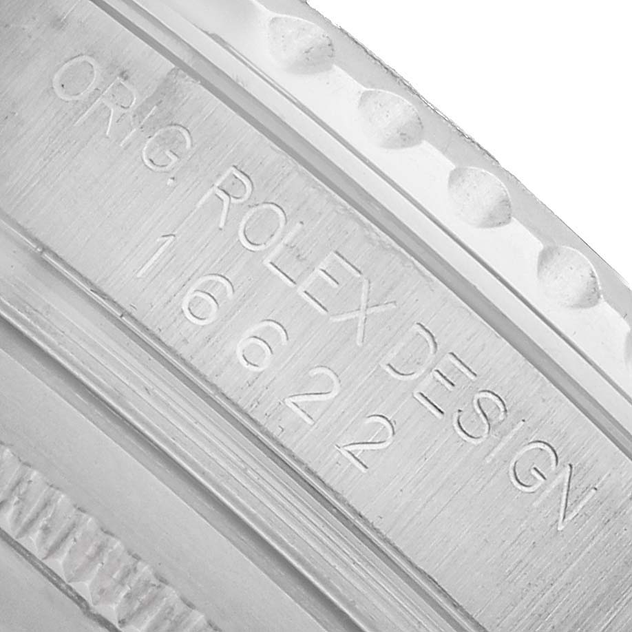 The image shows a close-up of the engraved side of a Rolex Yacht-Master 16622 Men's Stainless Steel Silver Dial watch, displaying "Orig. Rolex Design" and the model number.
