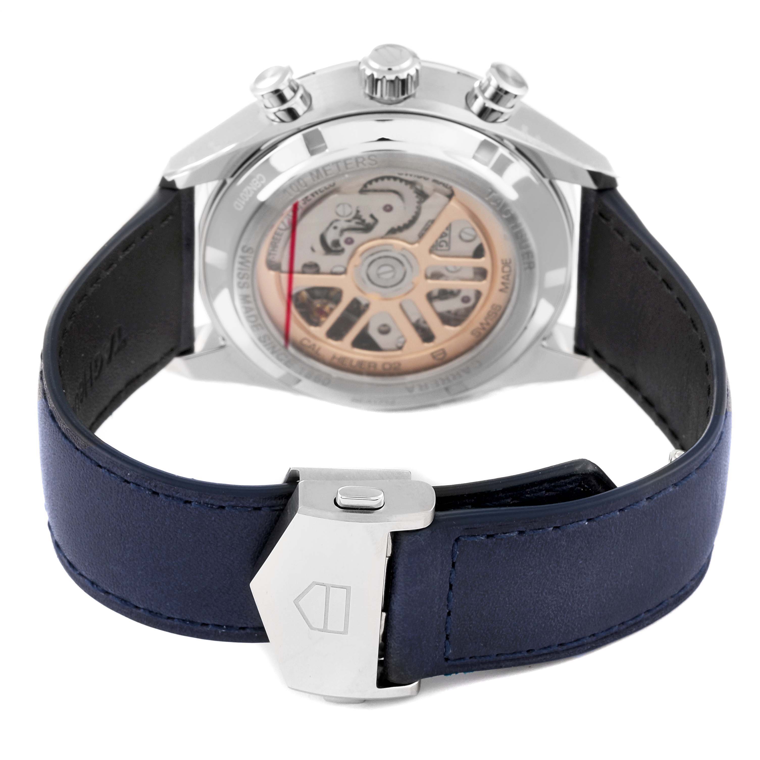 The image shows the back view of a Tag Heuer Carrera CBN201D.FC6543 Men's Stainless Steel Blue Dial CBN201D.FC6543 Men's Stainless Steel Blue Dial model watch, highlighting its movement and blue leather strap with clasp.