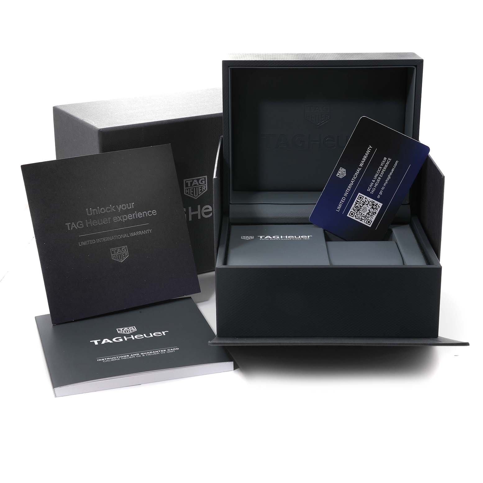 The image shows the packaging, instruction manual, and warranty card for the Tag Heuer Carrera CBN201D.FC6543 Men's Stainless Steel Blue Dial CBN201D.FC6543 Men's Stainless Steel Blue Dial watch, viewed from a straight-on angle.