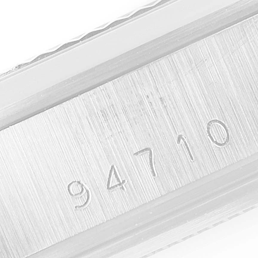 This image shows a close-up of the serial number engraving on the case of a Tudor Prince 94710 Men
s Stainless Steel Silver Dial 94710 Men
s Stainless Steel Silver Dial watch.