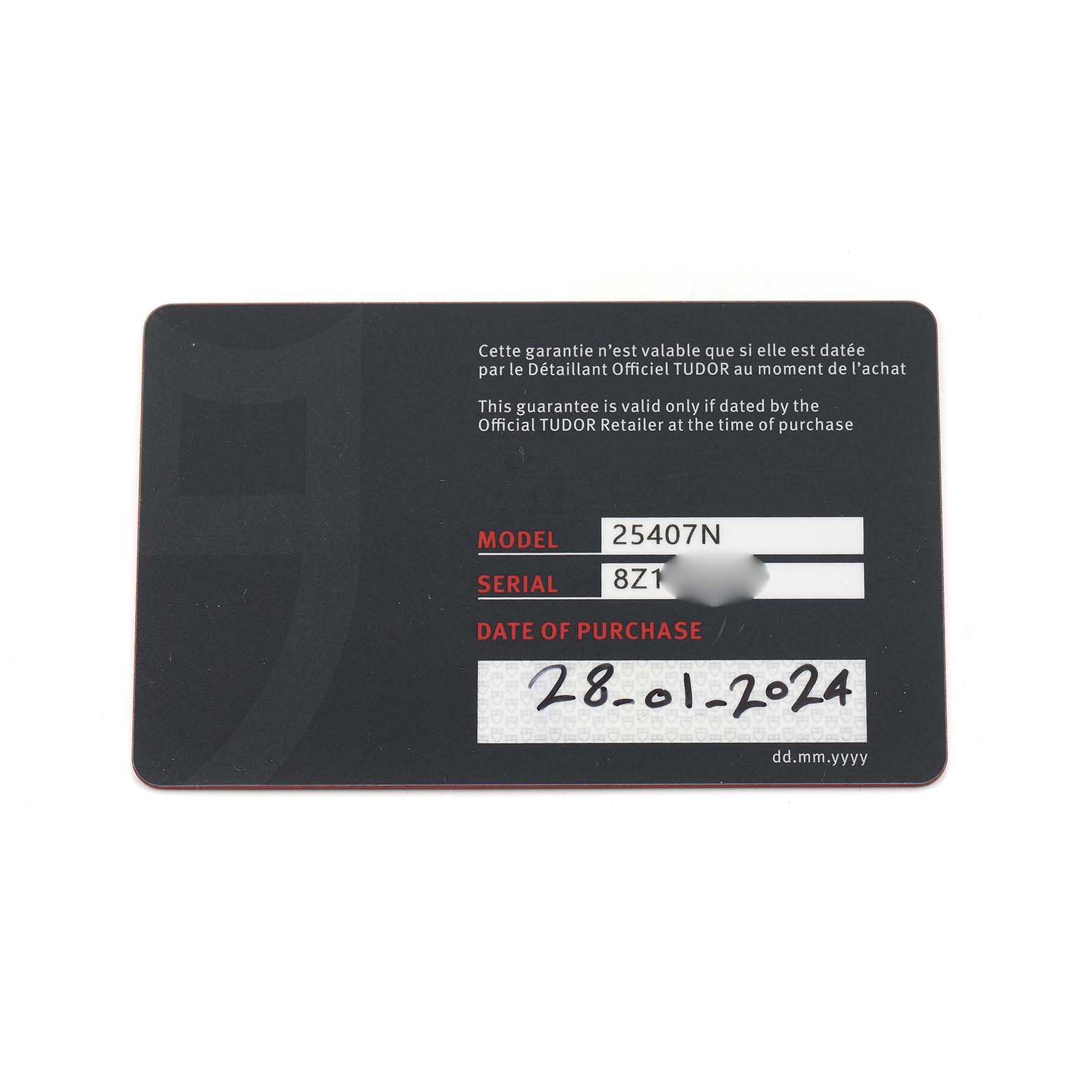 The image shows a Tudor warranty card for the Pelagos model, displaying model, serial number, and date of purchase.