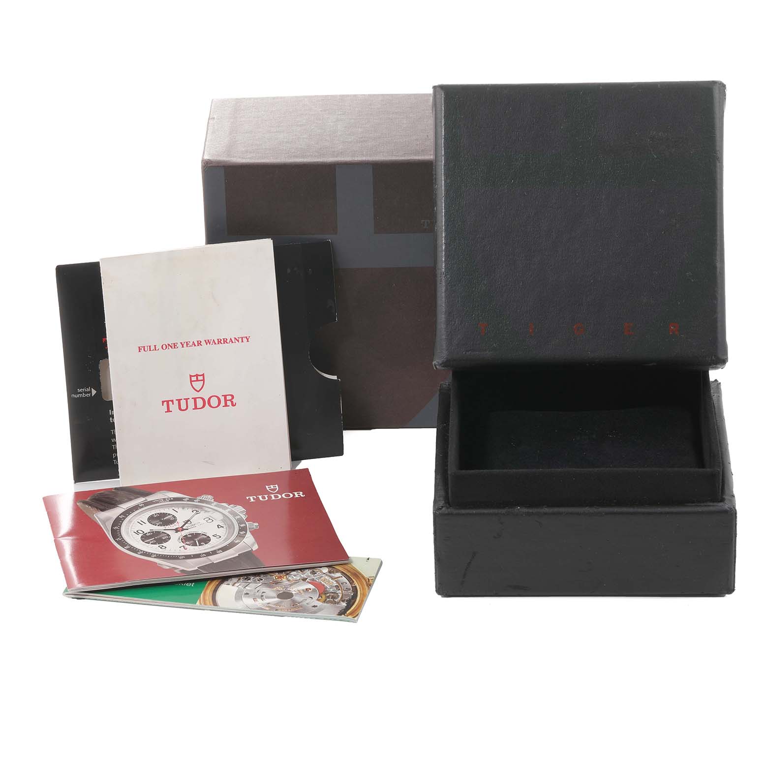 The image shows packaging and documentation, including the box and manuals, for the Tudor Tiger 79263 Men's Steel and Gold (two tone) White Dial 79263 Men's Steel and Gold (two tone) White Dial watch model.