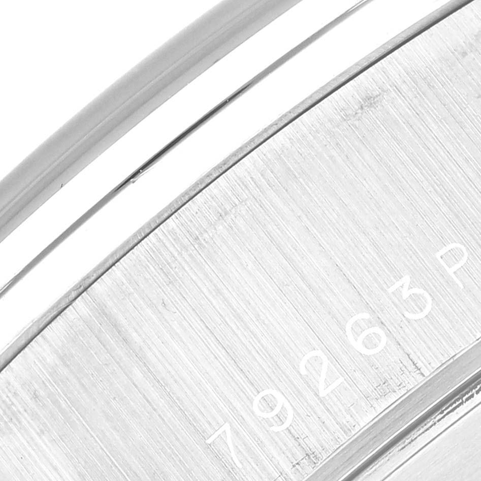 This image shows a close-up of the stainless steel back and edge of the Tudor Tiger 79263 Men's Steel and Gold (two tone) White Dial 79263 Men's Steel and Gold (two tone) White Dial model watch with partial engraving visible.
