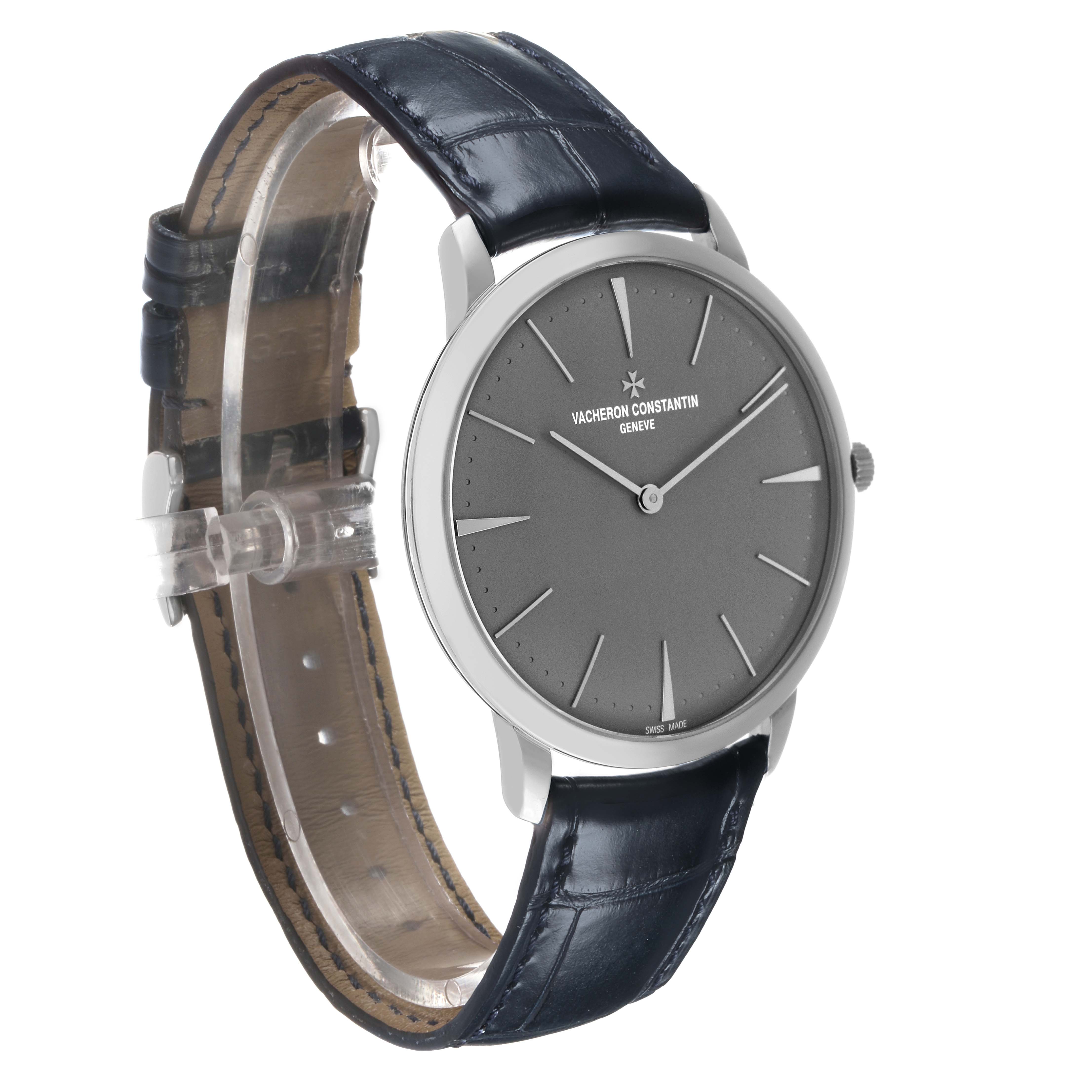 The Vacheron Constantin Patrimony 81180/000P-9539 Men's Platinum Grey Dial watch is shown at a 3/4 angle, highlighting the dial, case, crown, and leather strap.