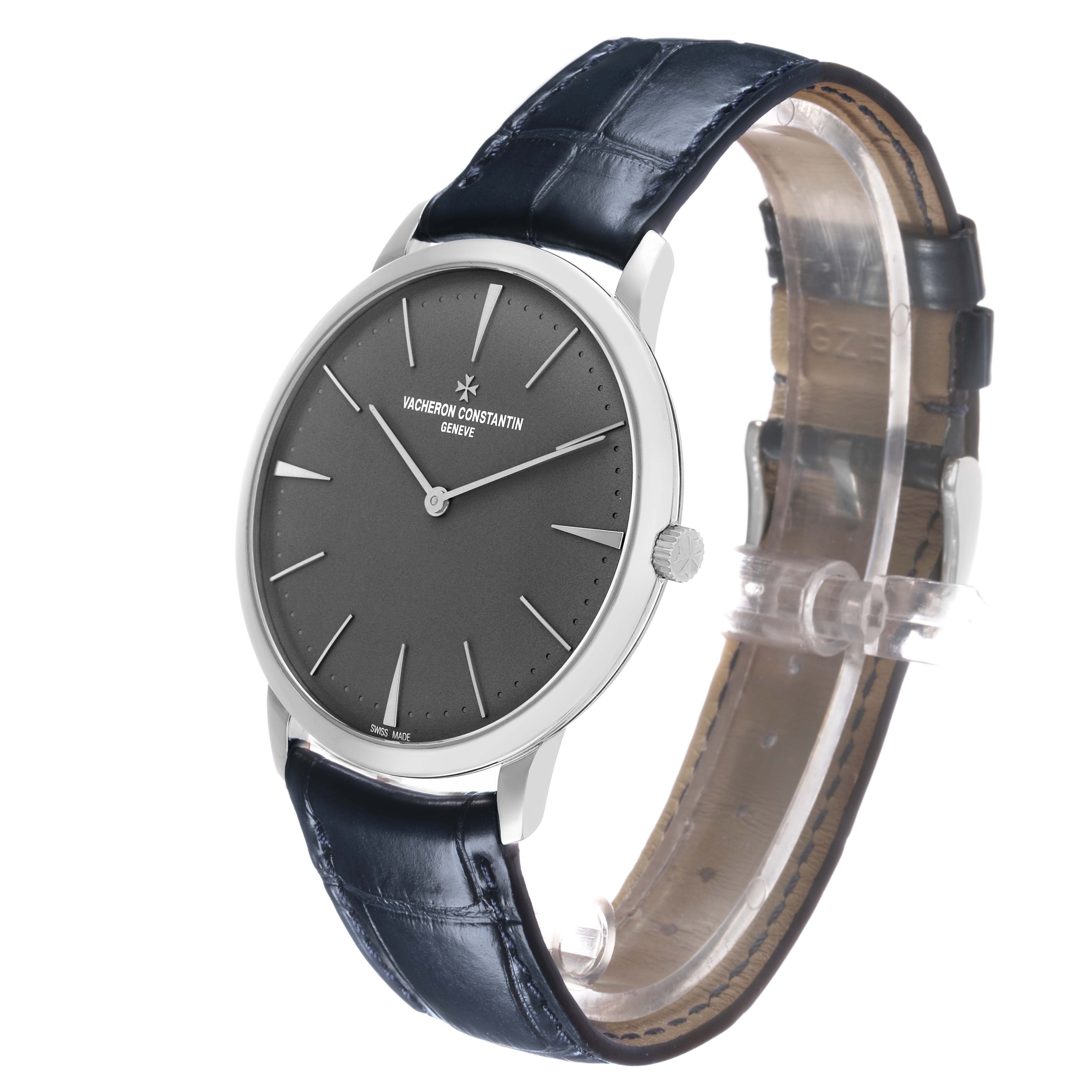The Vacheron Constantin Patrimony 81180/000P-9539 Men's Platinum Grey Dial watch is shown at a three-quarter angle, highlighting the watch face, side profile, crown, and leather strap.