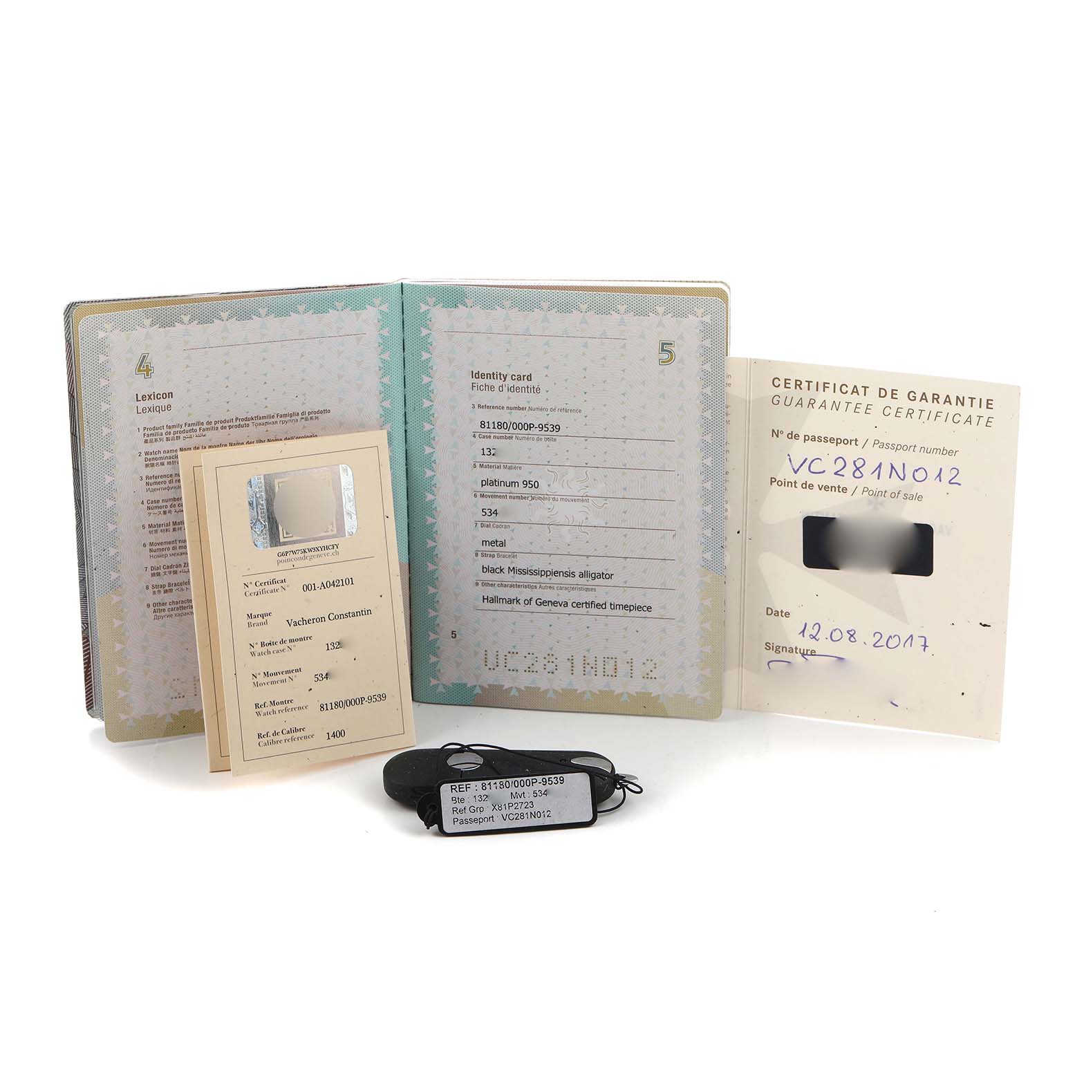 The image shows documentation and tags for the Patrimony model by Vacheron Constantin, including a guarantee certificate and identity card.