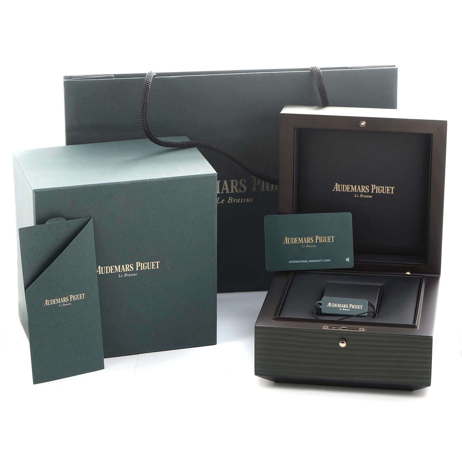 The image shows the packaging, warranty card, and box for an Audemars Piguet Royal Oak 77451OR Women's Rose Gold Blue Dial watch.