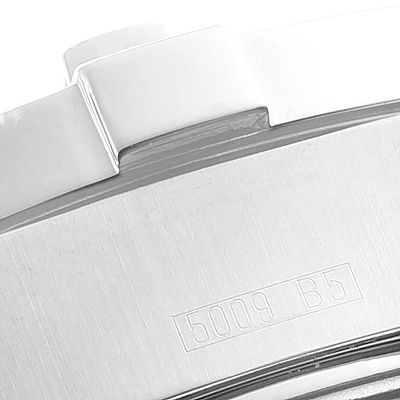 This close-up image shows a portion of the bezel and case of the Breitling Superocean A17390 Men
s Stainless Steel Blue Dial A17390 Men
s Stainless Steel Blue Dial watch, including the reference number engraving "5009 B5."
