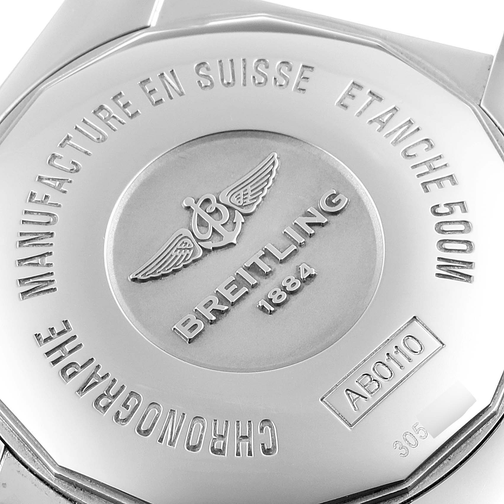 The image shows the back case of a Breitling Chronomat AB0110 Men
s Stainless Steel Blue Dial AB0110 Men
s Stainless Steel Blue Dial watch, detailing its engravings and brand logo.