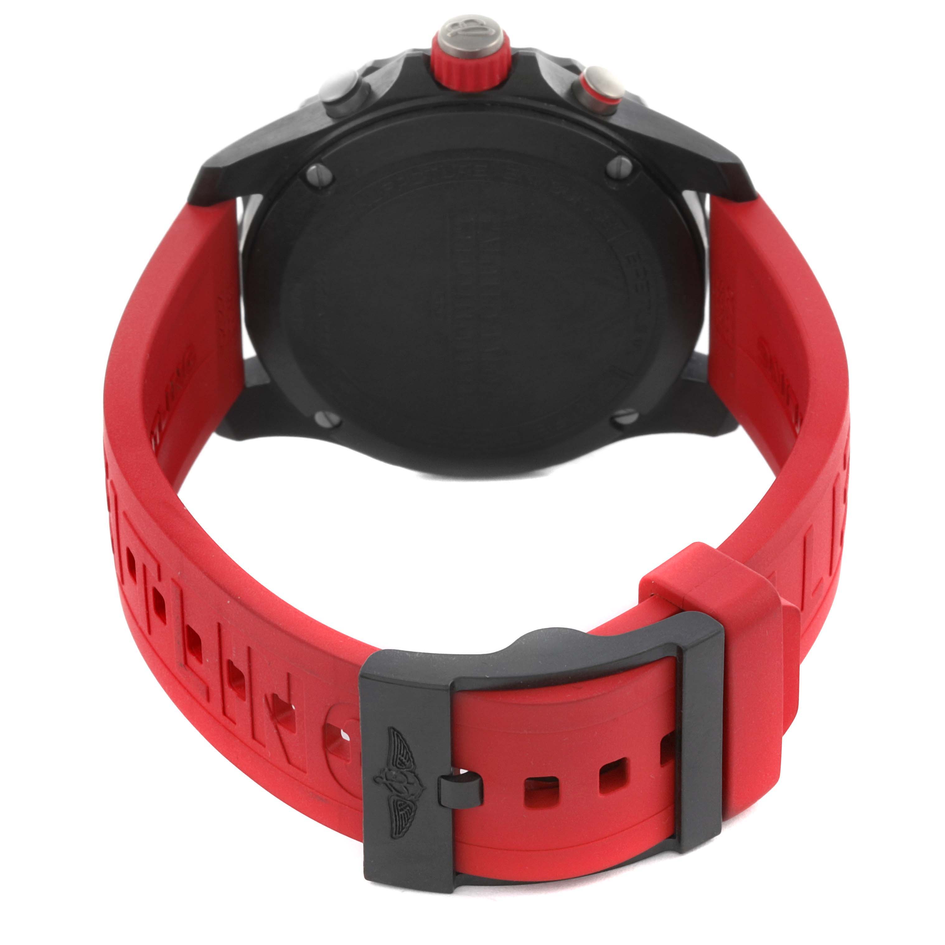 The image shows the back and clasp of a Breitling Professional Series X82310 Men's Ceramic Black Dial X82310 Men's Ceramic Black Dial watch with a red strap.