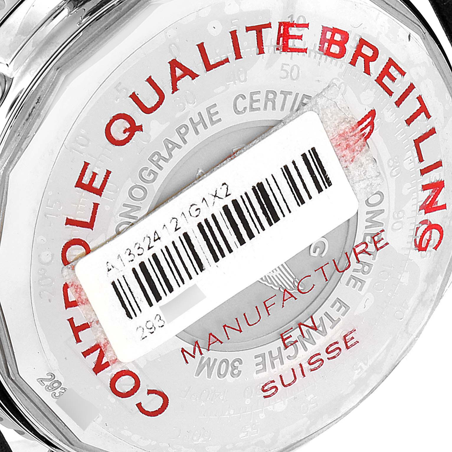 The image shows the back case of a Breitling Navitimer A13324 Men's Stainless Steel White Dial A13324 Men's Stainless Steel White Dial watch, with a barcode label partially covering the engravings.