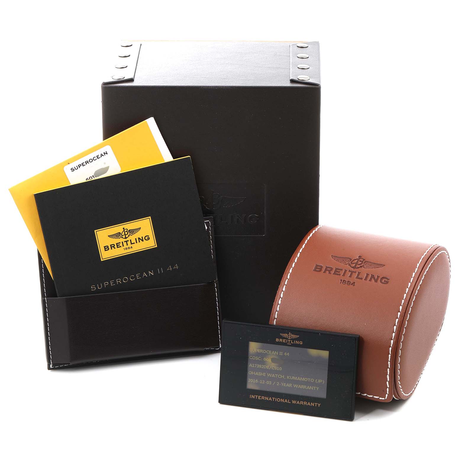 The image shows packaging and accessories for the Breitling Superocean A17392 Men's Stainless Steel Blue Dial A17392 Men's Stainless Steel Blue Dial model, including a box, pouch, warranty card, and manuals.