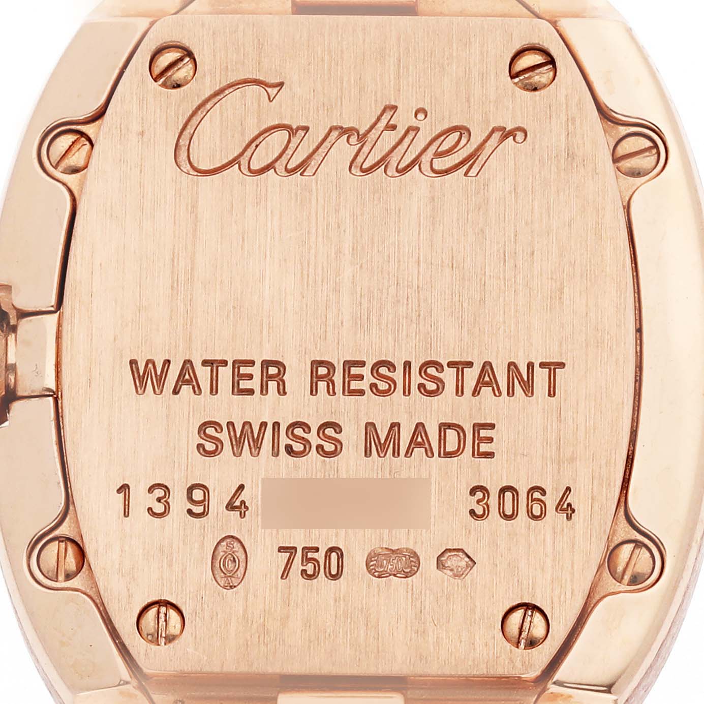 The image shows the back case of a Cartier Baignoire W8000005 Women's Rose Gold Silver Dial watch, featuring engravings and screws.