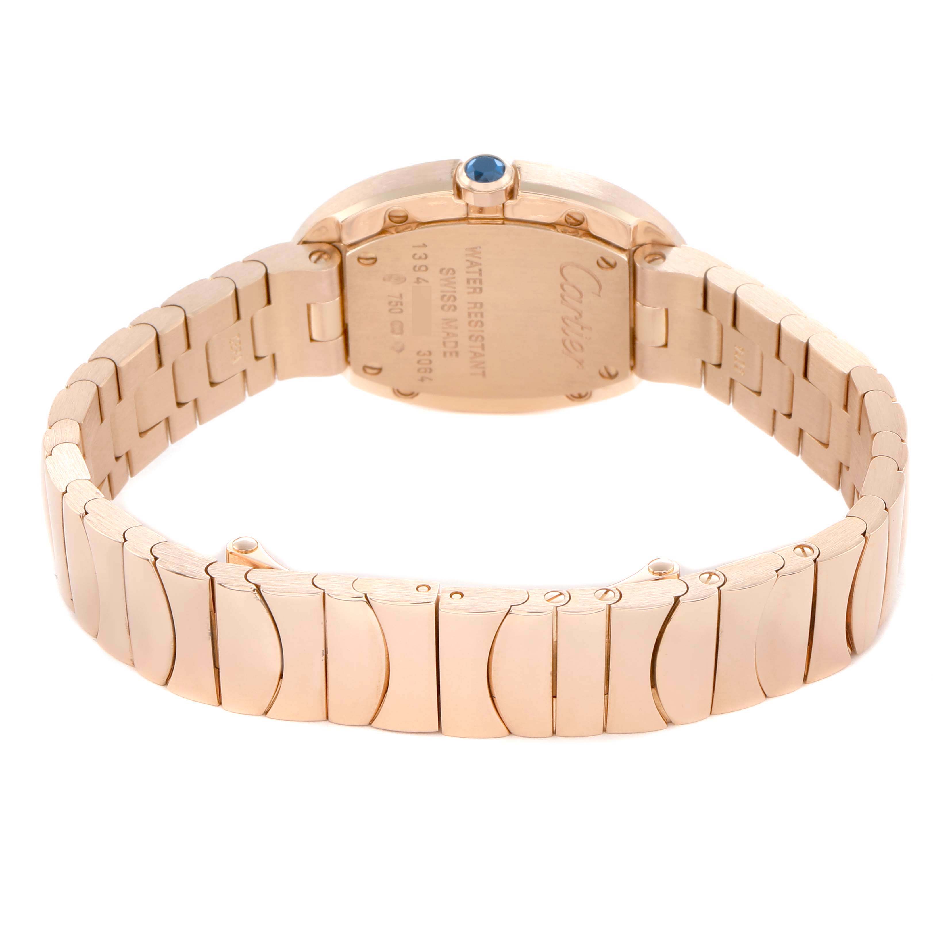 The image shows the back of a Cartier Baignoire W8000005 Women's Rose Gold Silver Dial watch, highlighting its case back, bracelet, and a blue cabochon crown.