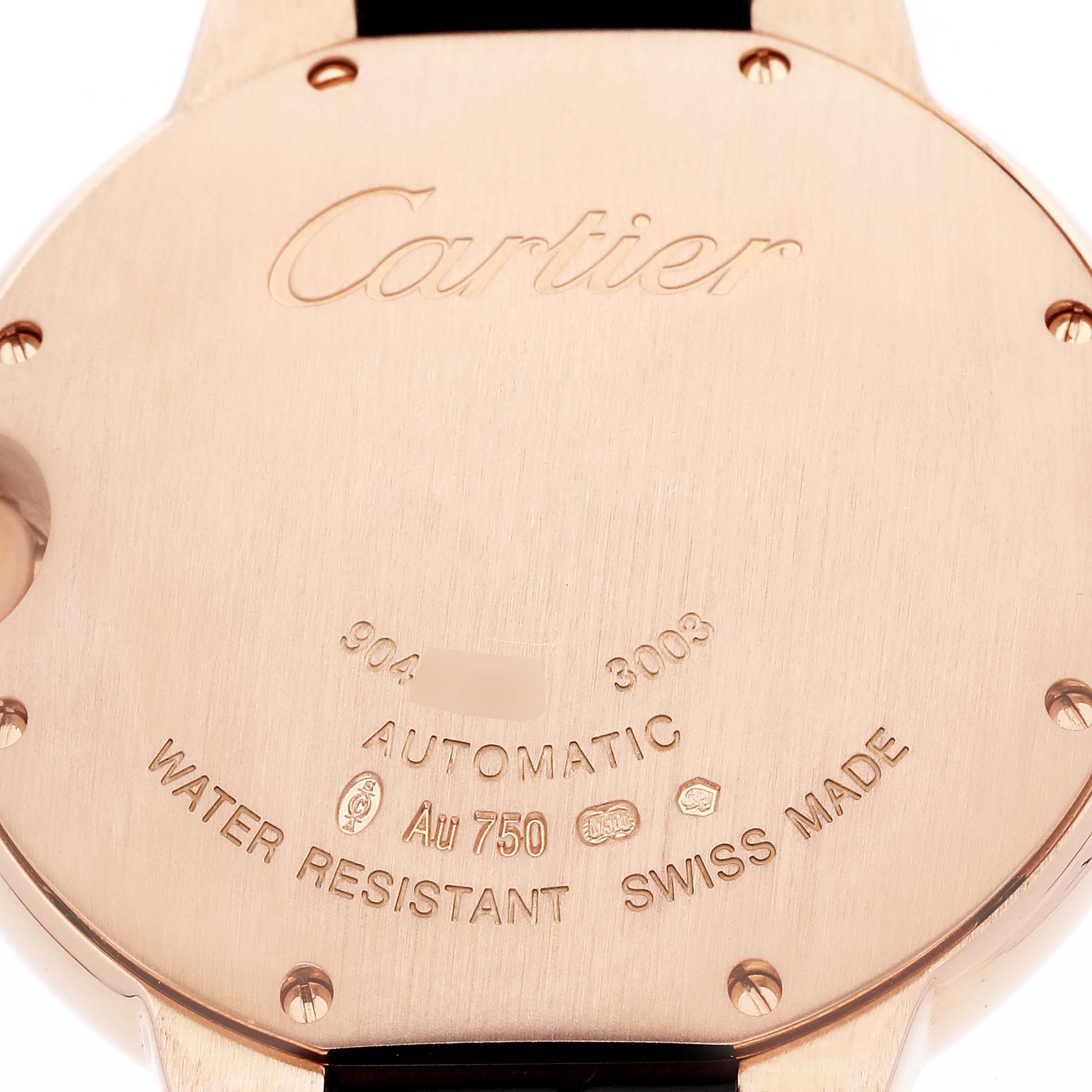 The image shows the back case of a Cartier Ballon Bleu WE902028 Women's Rose Gold Silver Dial watch, highlighting the brand engraving and specifications.