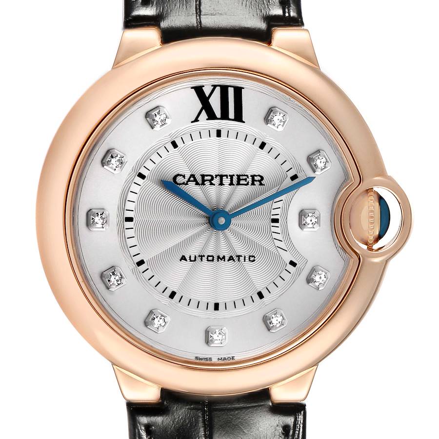 The Cartier Ballon Bleu WE902028 Women's Rose Gold Silver Dial watch is shown from the front, highlighting its dial, hands, and distinctive crown.