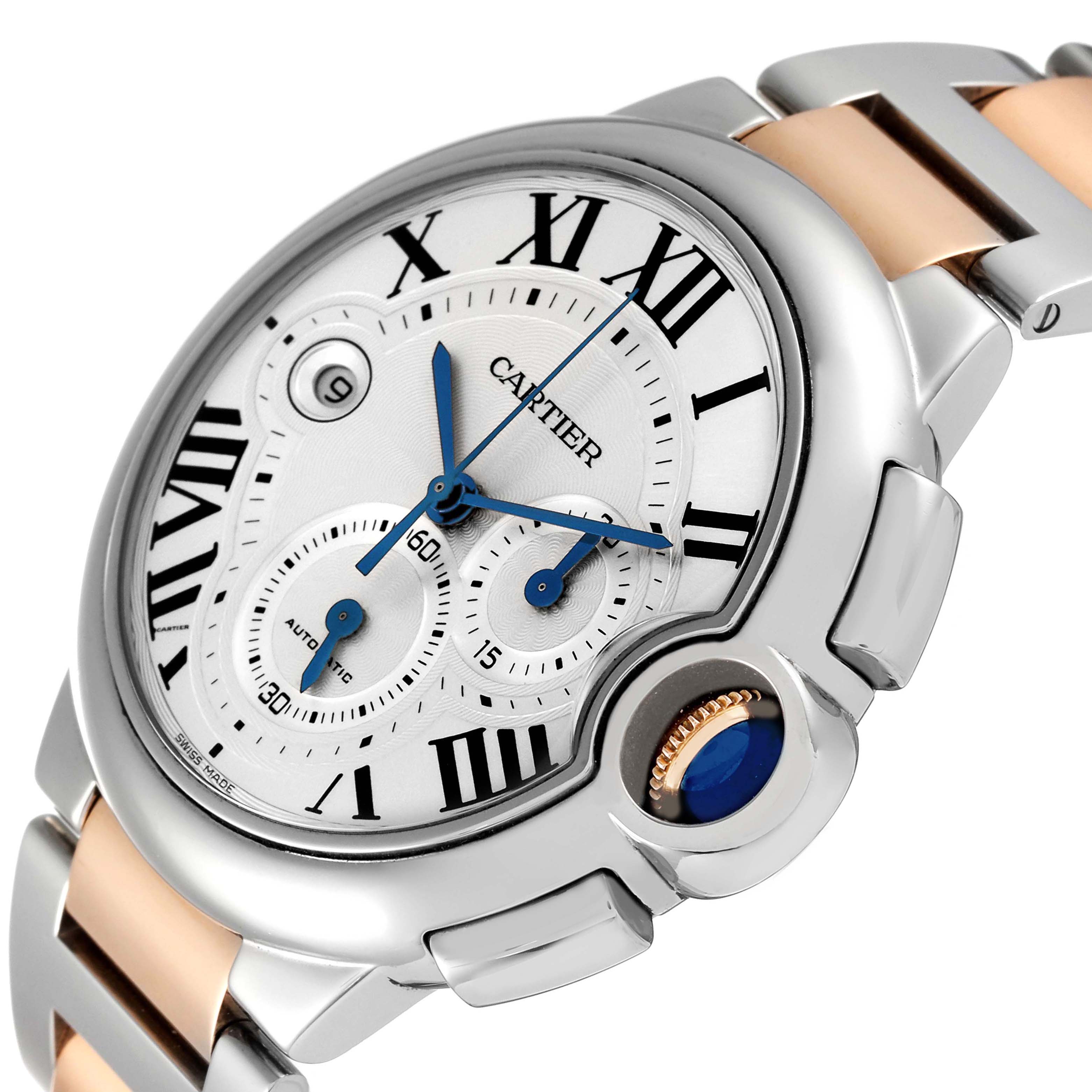 The Cartier Ballon Bleu W6920063 Men's Steel and Gold (two tone) Silver Dial watch is shown at an angle displaying the dial, Roman numerals, hands, and crown with a blue cabochon.