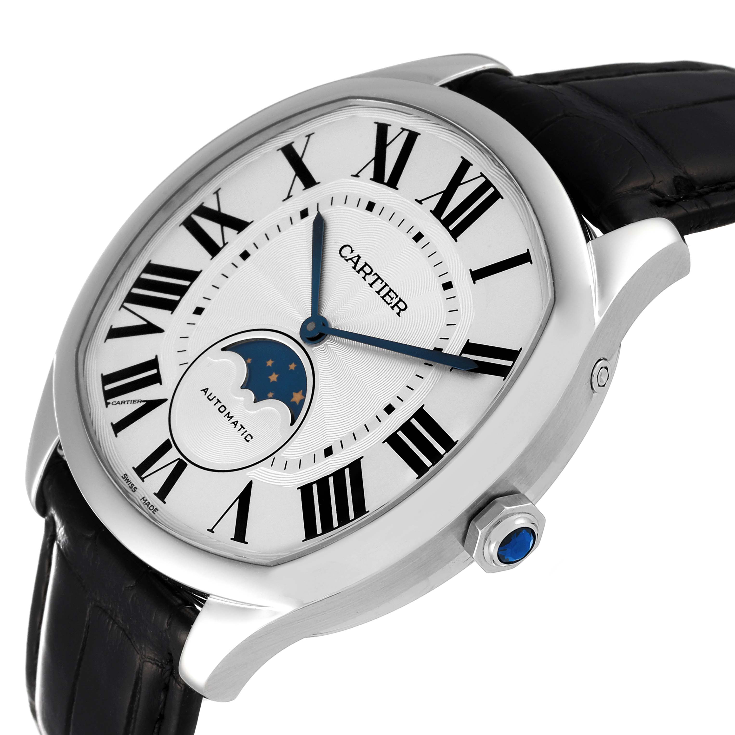 The Drive de Cartier watch by Cartier is shown at an oblique angle, highlighting the dial, Roman numerals, moon phase, and crown.