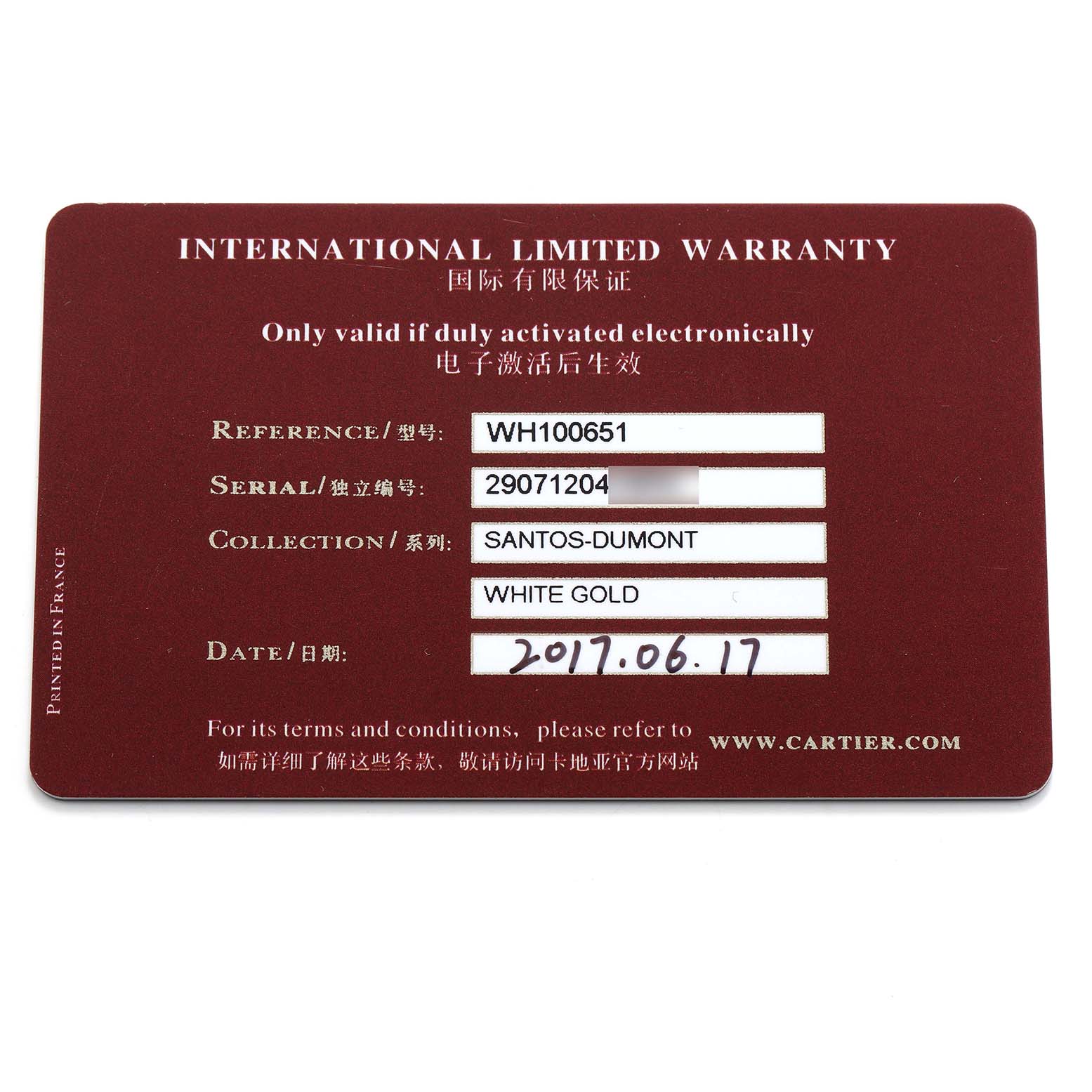 The image shows an International Limited Warranty card for the Cartier Santos-Dumont model, noting reference and serial numbers.