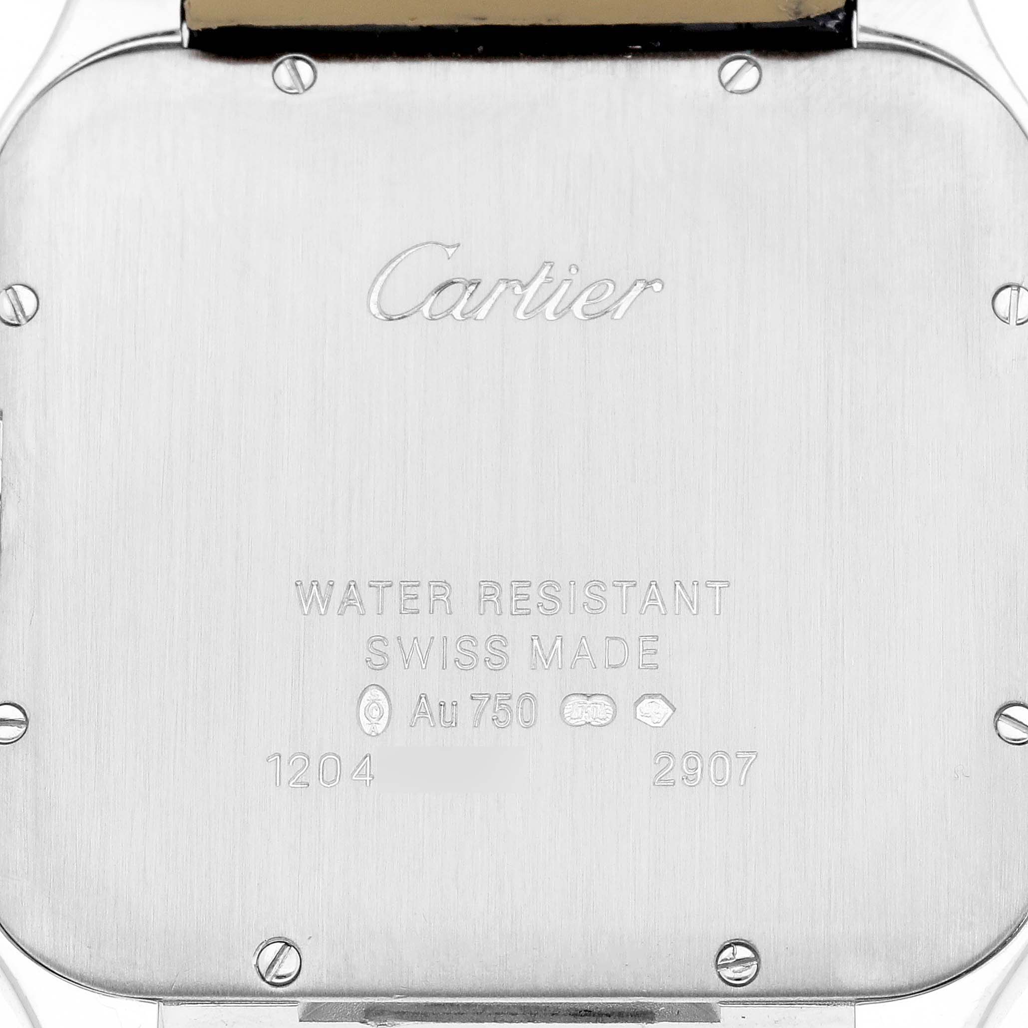 The image shows the back case of a Cartier Santos Dumont WH100651 Men's White Gold Silver Dial watch with engraved text and visible screws.